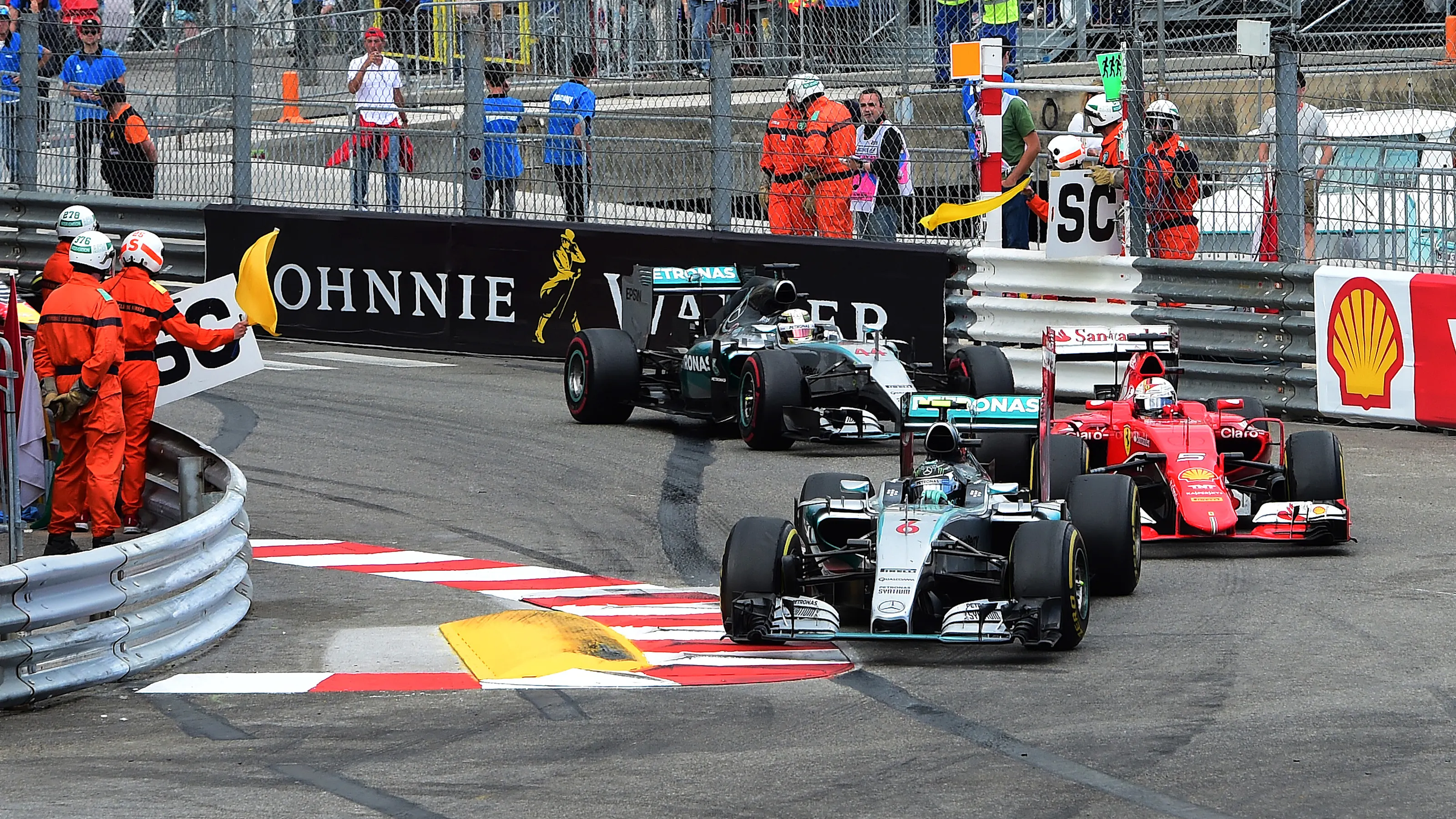 Nico Rosberg (GER) Mercedes AMG F1 W06 leads Sebastian Vettel (GER) Ferrari SF15-T and Lewis
