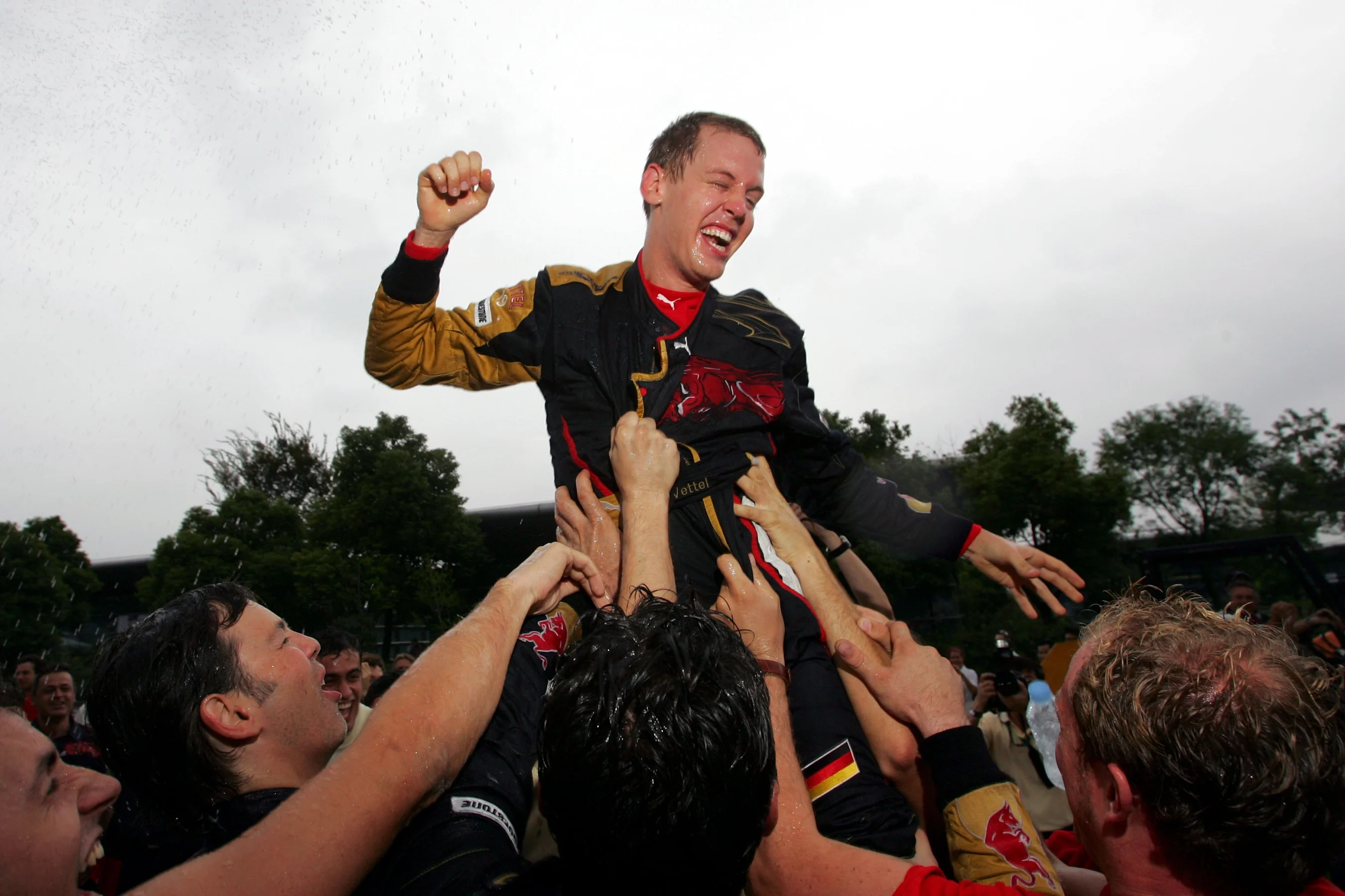 Sebastian Vettel (GER) Scuderia Toro Rosso celebrates with the team.  Formula One World