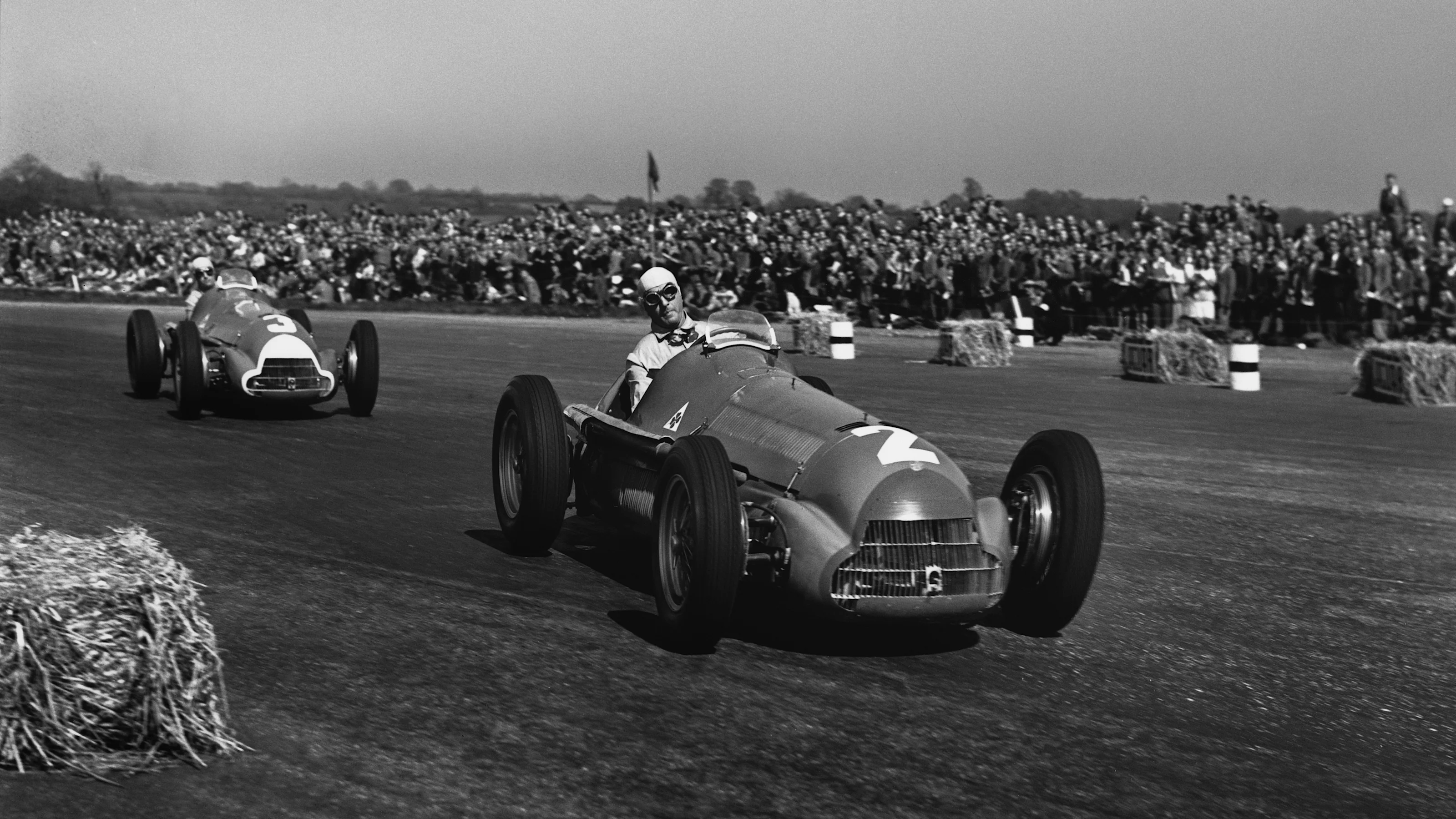 Silverstone, England. 11-13 May 1950. Guiseppe Farina (Alfa Romeo 158), 1st position, leads Luigi