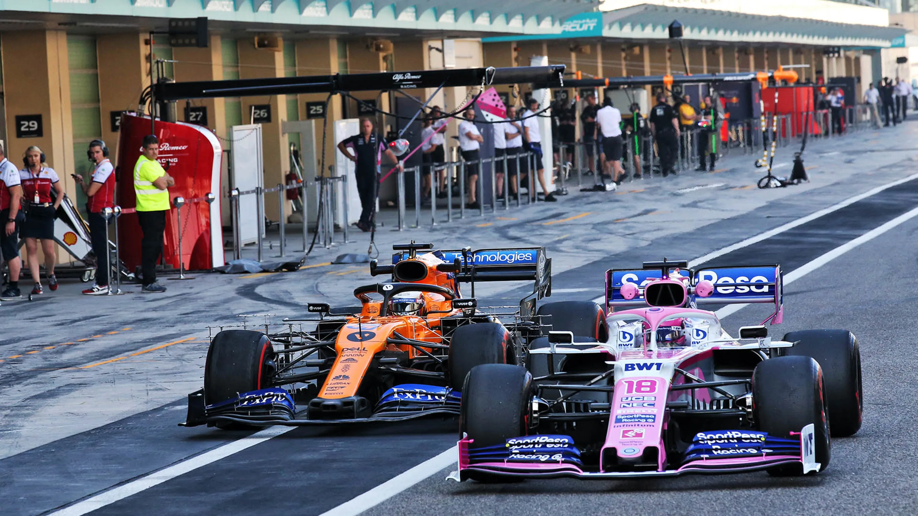 Lance Stroll (CDN) Racing Point F1 Team RP19 and Carlos Sainz Jr (ESP) McLaren MCL34 in the