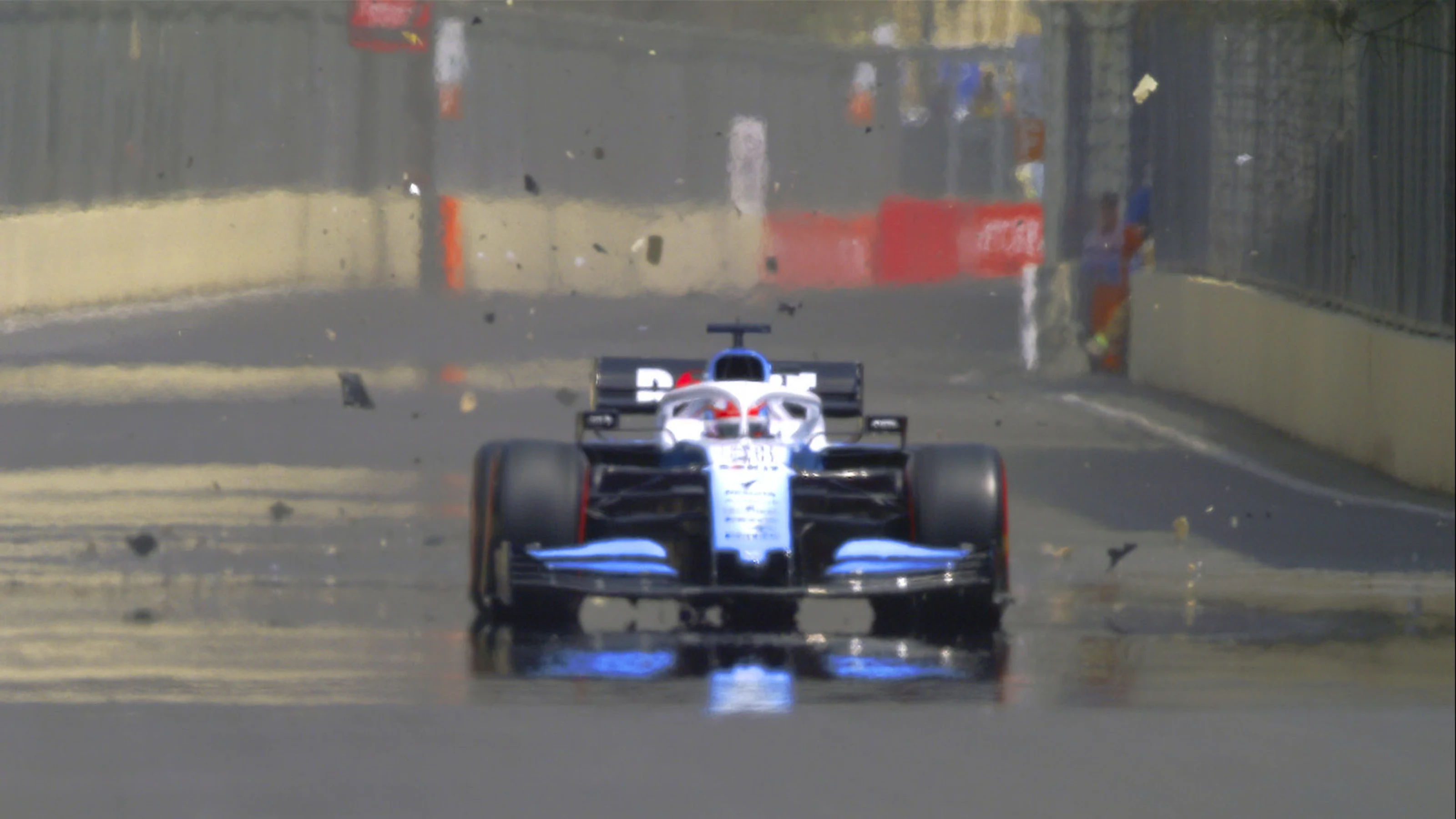 Russell hits drain cover