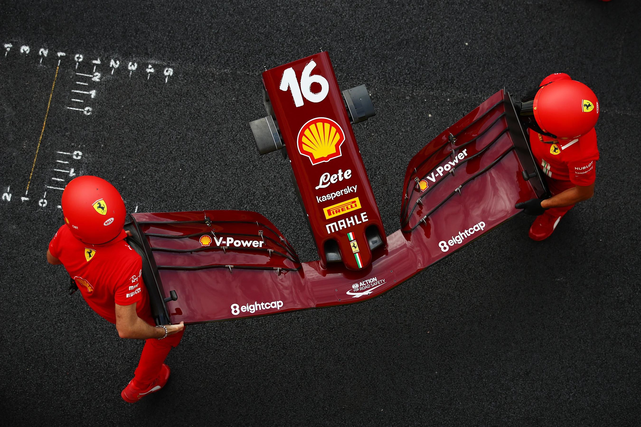 SCARPERIA, ITALY - SEPTEMBER 10: The Ferrari team practice pitstops during previews ahead of the F1