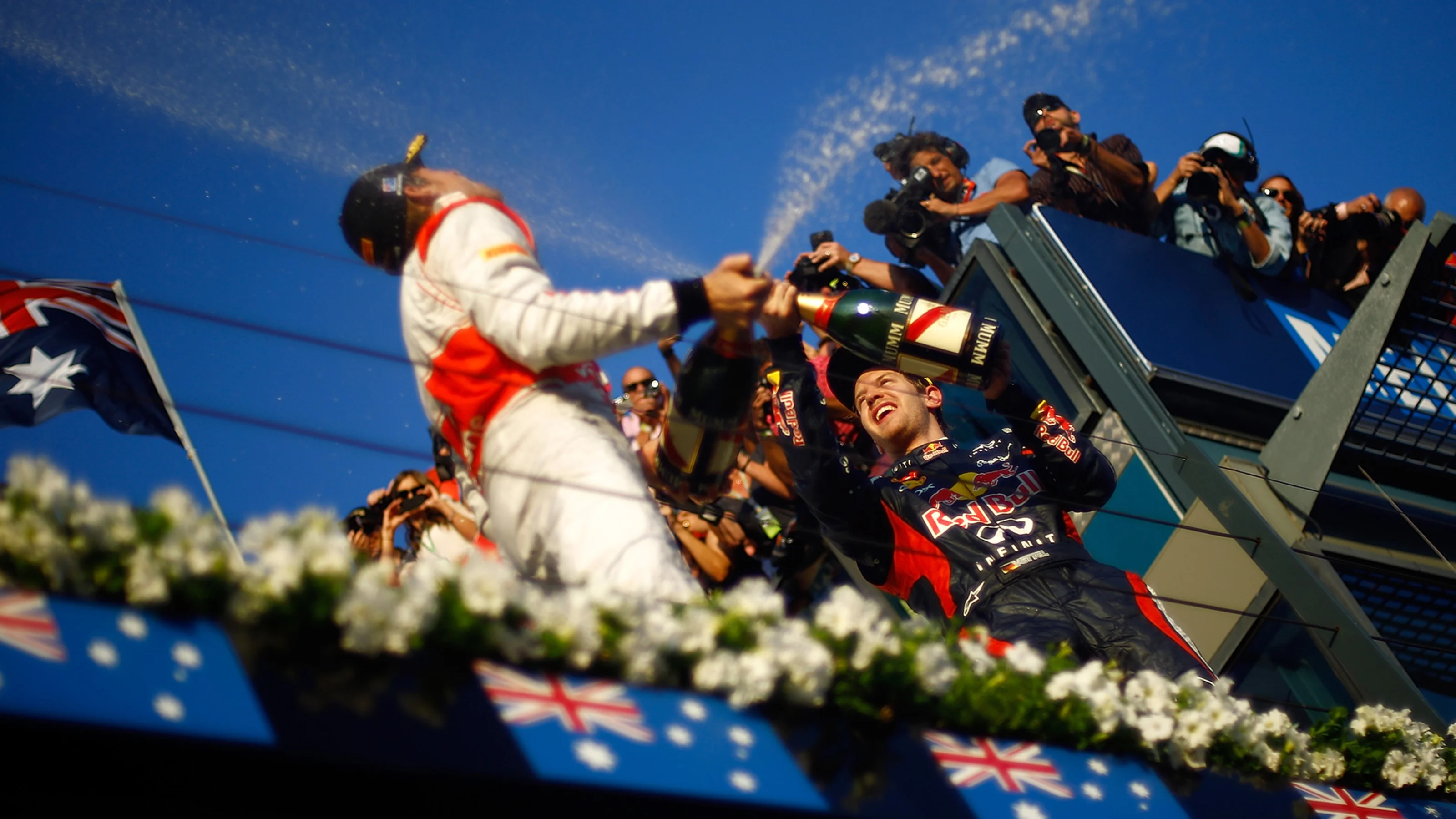 MELBOURNE, AUSTRALIA - MARCH 18: Jenson Button of Great Britain and McLaren (finishing first)