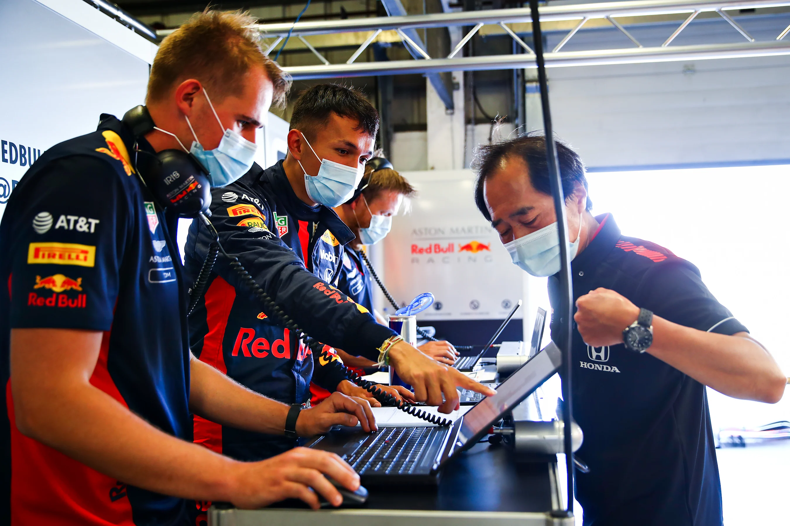 NORTHAMPTON, ENGLAND - JUNE 25: Alexander Albon of Thailand and Red Bull Racing talks with Toyoharu
