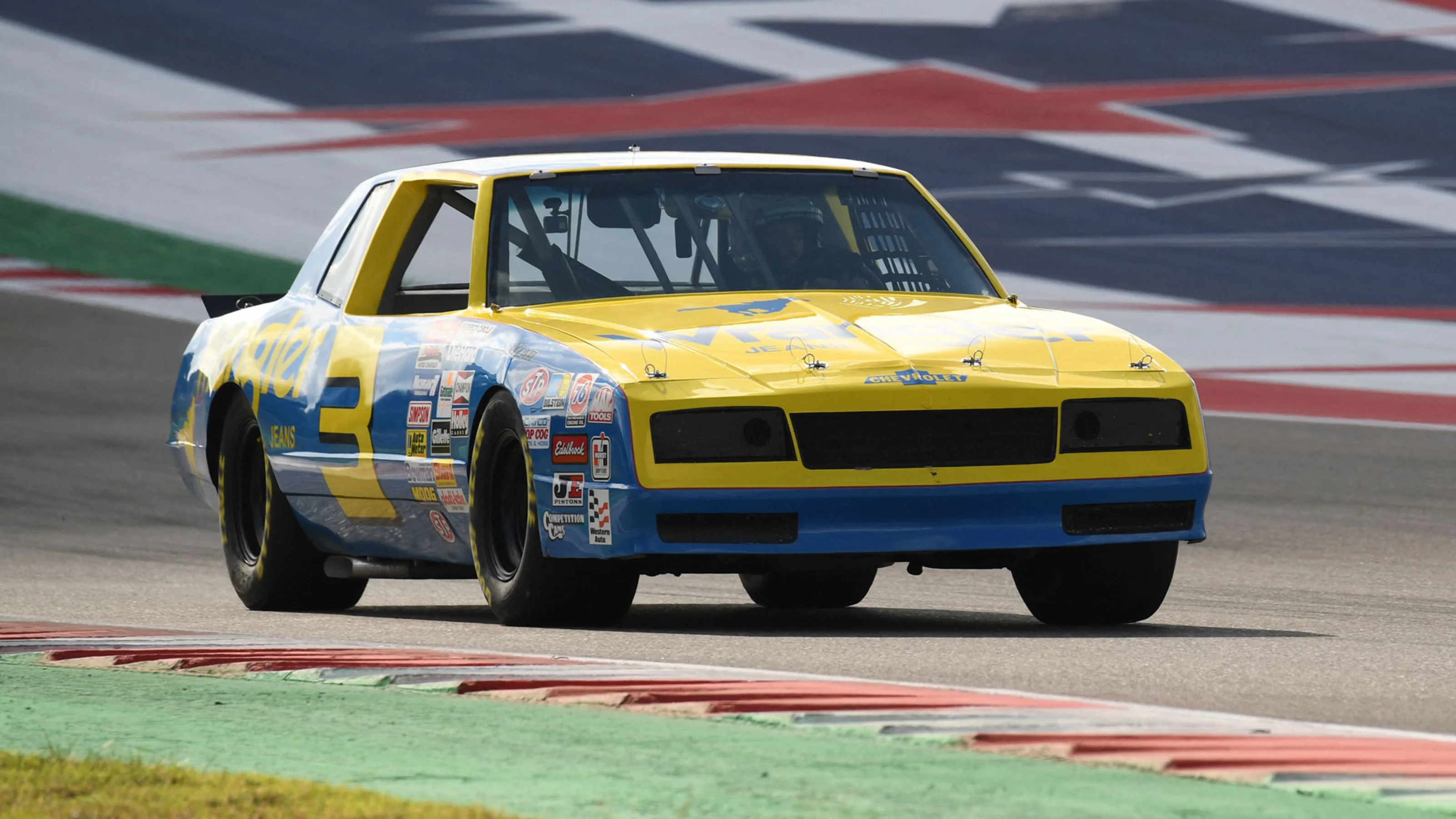 McLarens Australian driver Daniel Ricciardo drives the NASCAR 1984 Dale Earnhardt Cup car on the