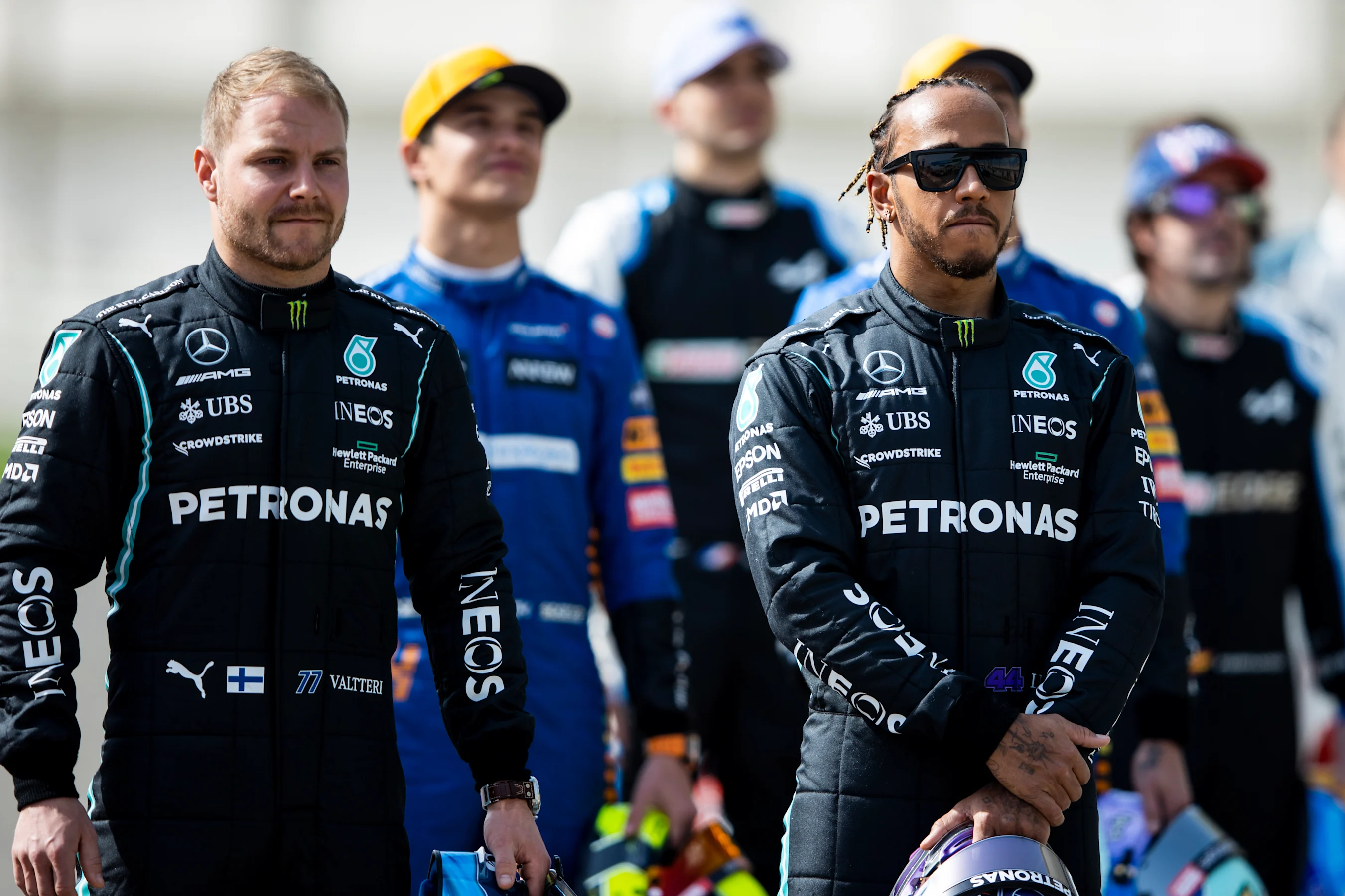 BAHRAIN, BAHRAIN - MARCH 12: Lewis Hamilton of Great Britain and Mercedes GP and Valtteri Bottas of