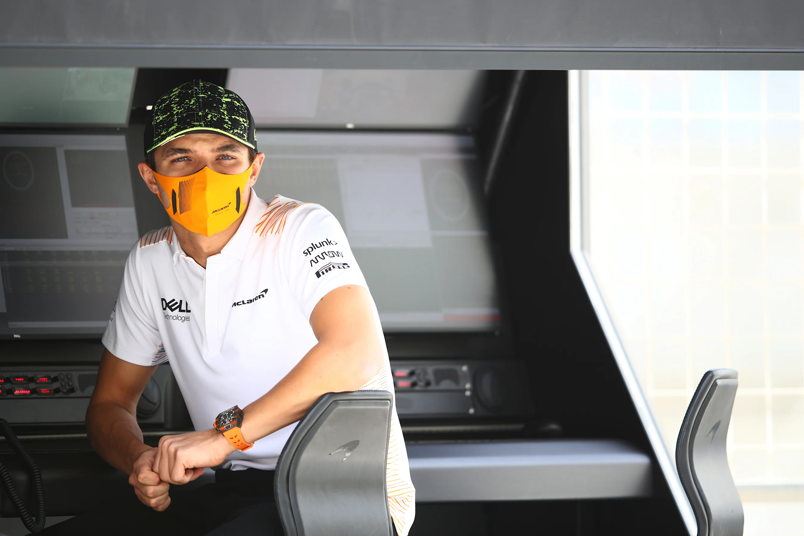 BAHRAIN, BAHRAIN - MARCH 13: Lando Norris of Great Britain and McLaren F1 looks on from the pitwall