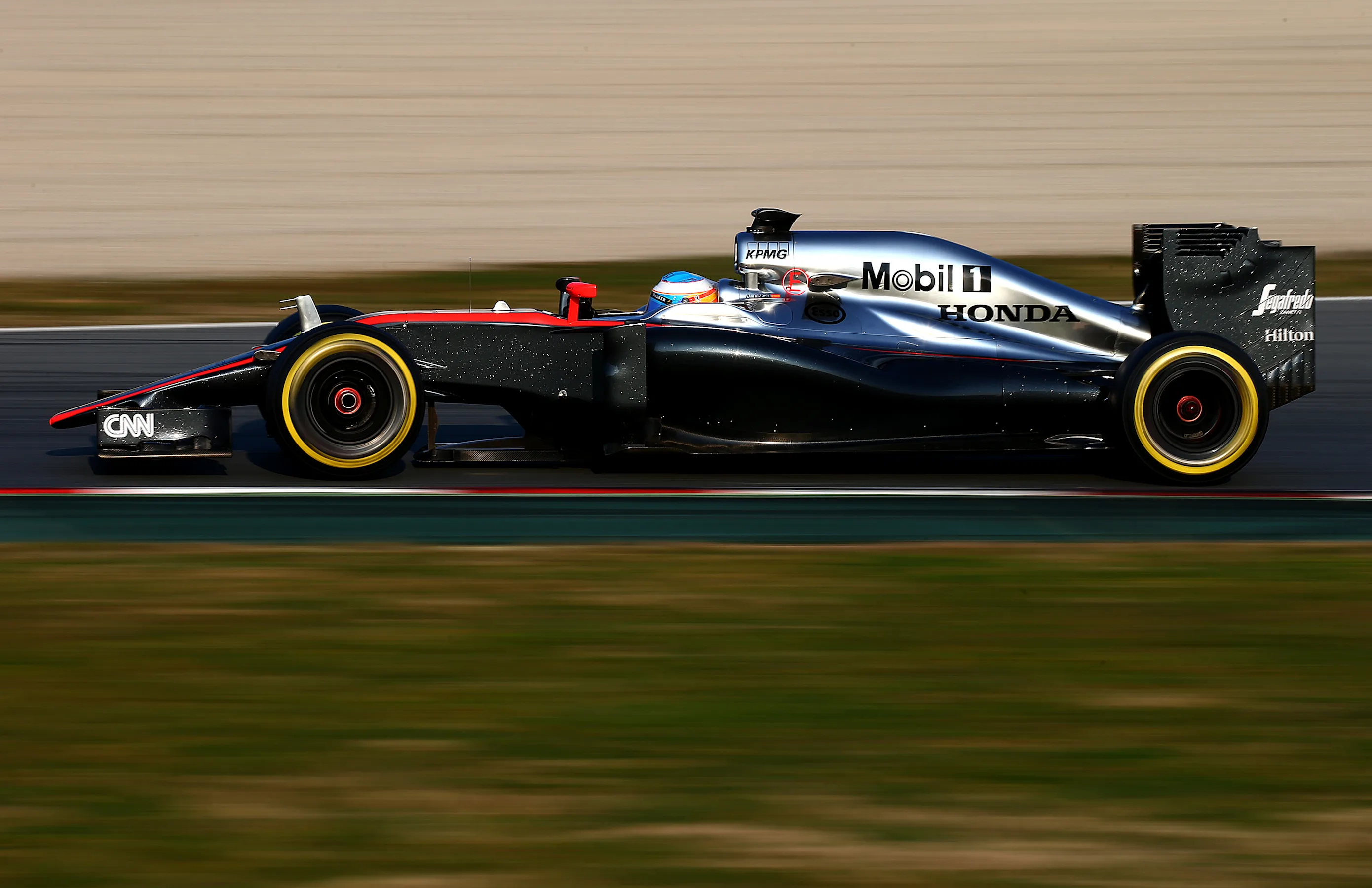 MONTMELO, SPAIN - FEBRUARY 20:  Fernando Alonso of Spain and McLaren Honda drives during day two of