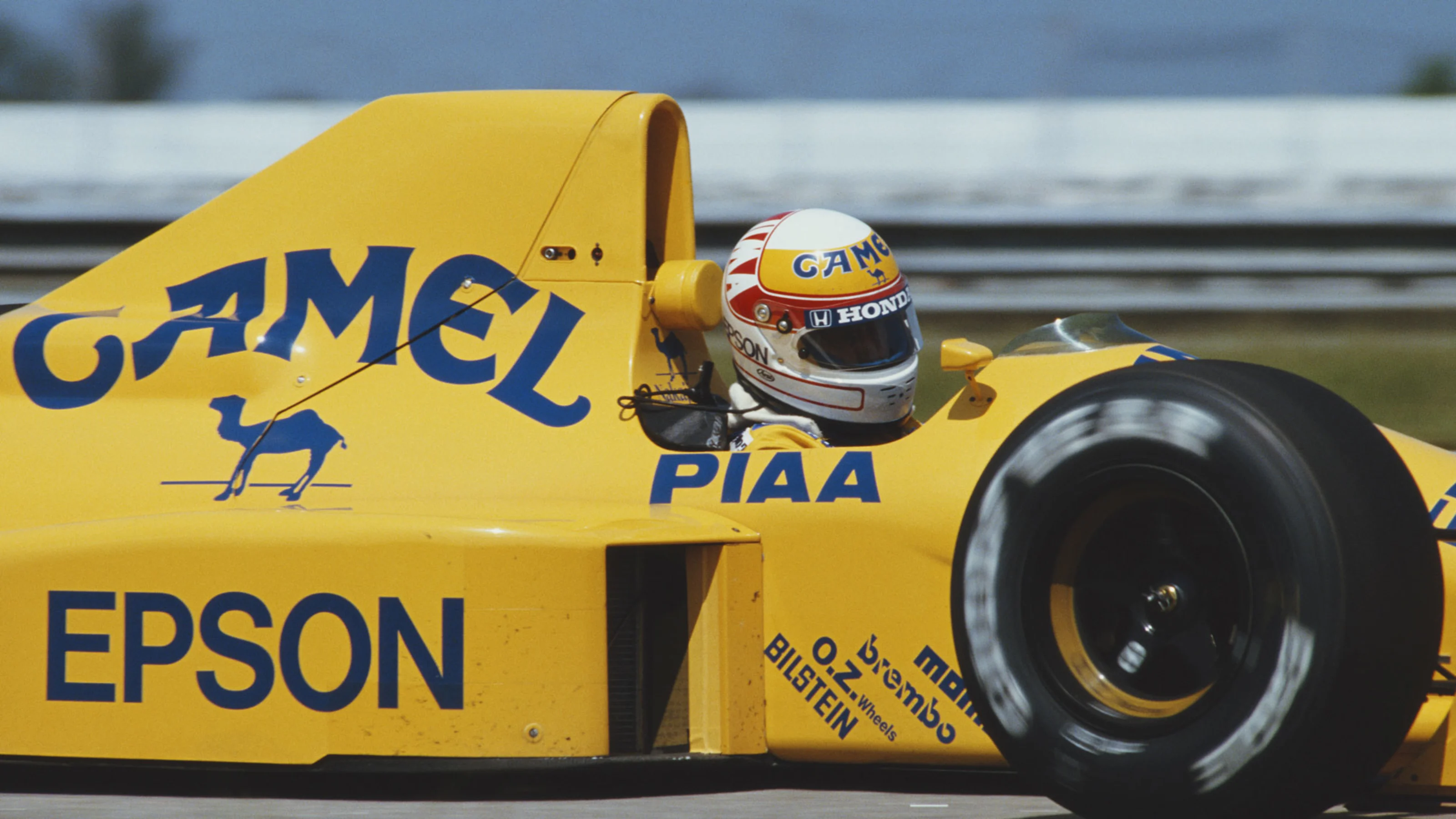 Satoru Nakajima of Japan drives the #12 Camel Team Lotus Lotus 101 Judd V8 during practice for the
