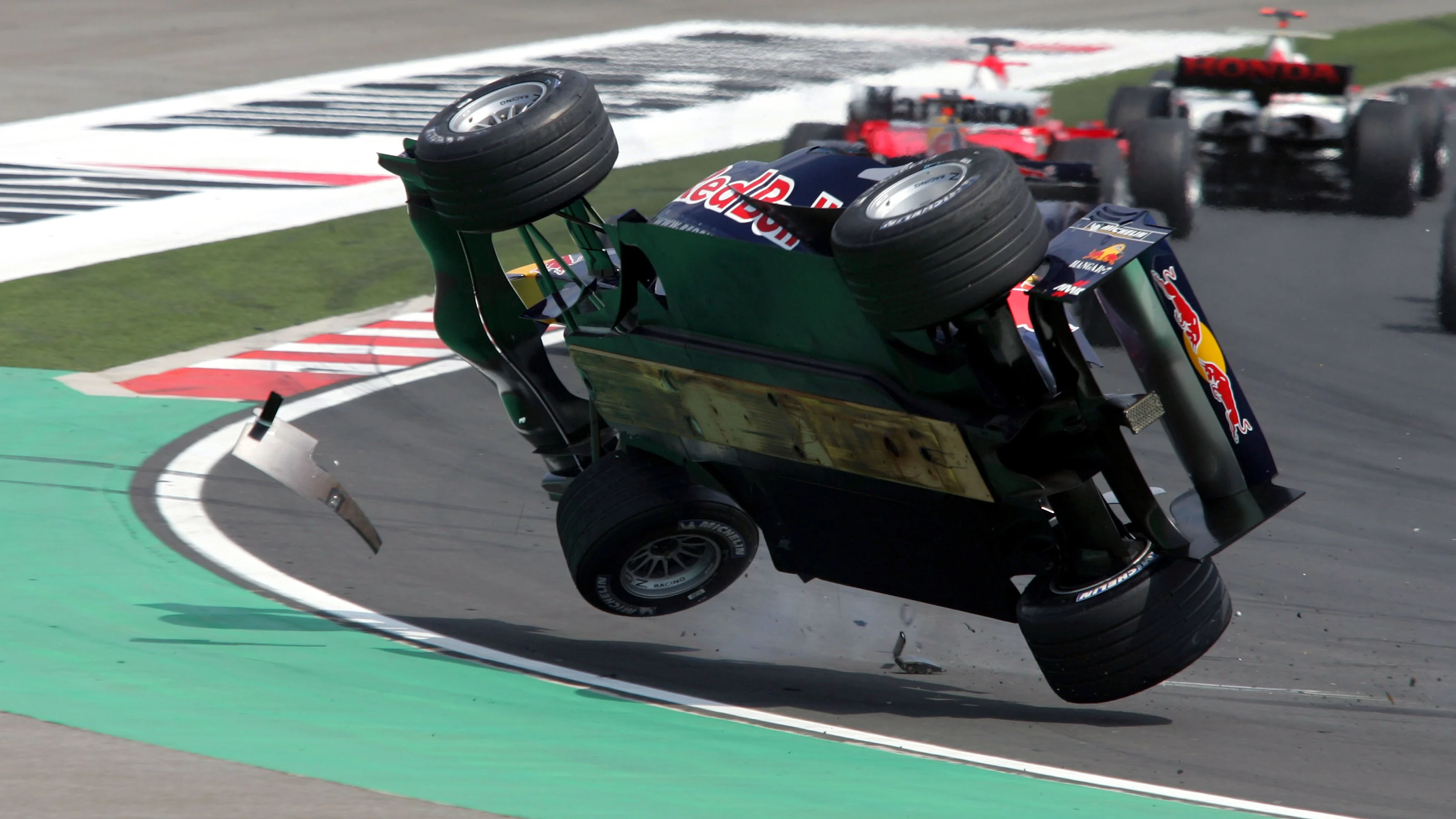 Christian Klien (AUT) Red Bull Racing RB1 rolls. Formula One World Championship, Rd13, Hungarian