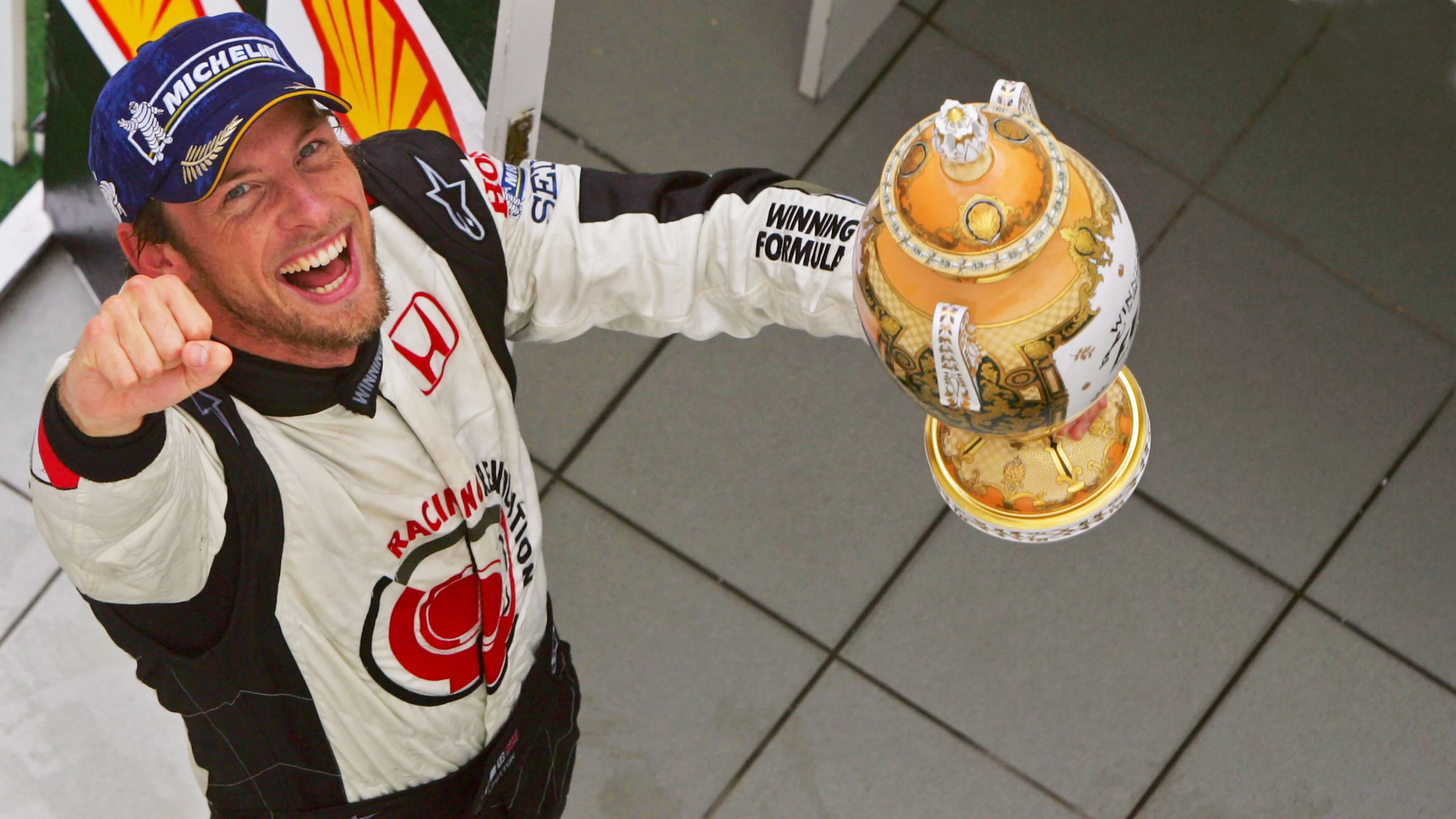 Race winner Jenson Button (GBR) Honda Racing RA106 celebrates on the podium. Formula One World