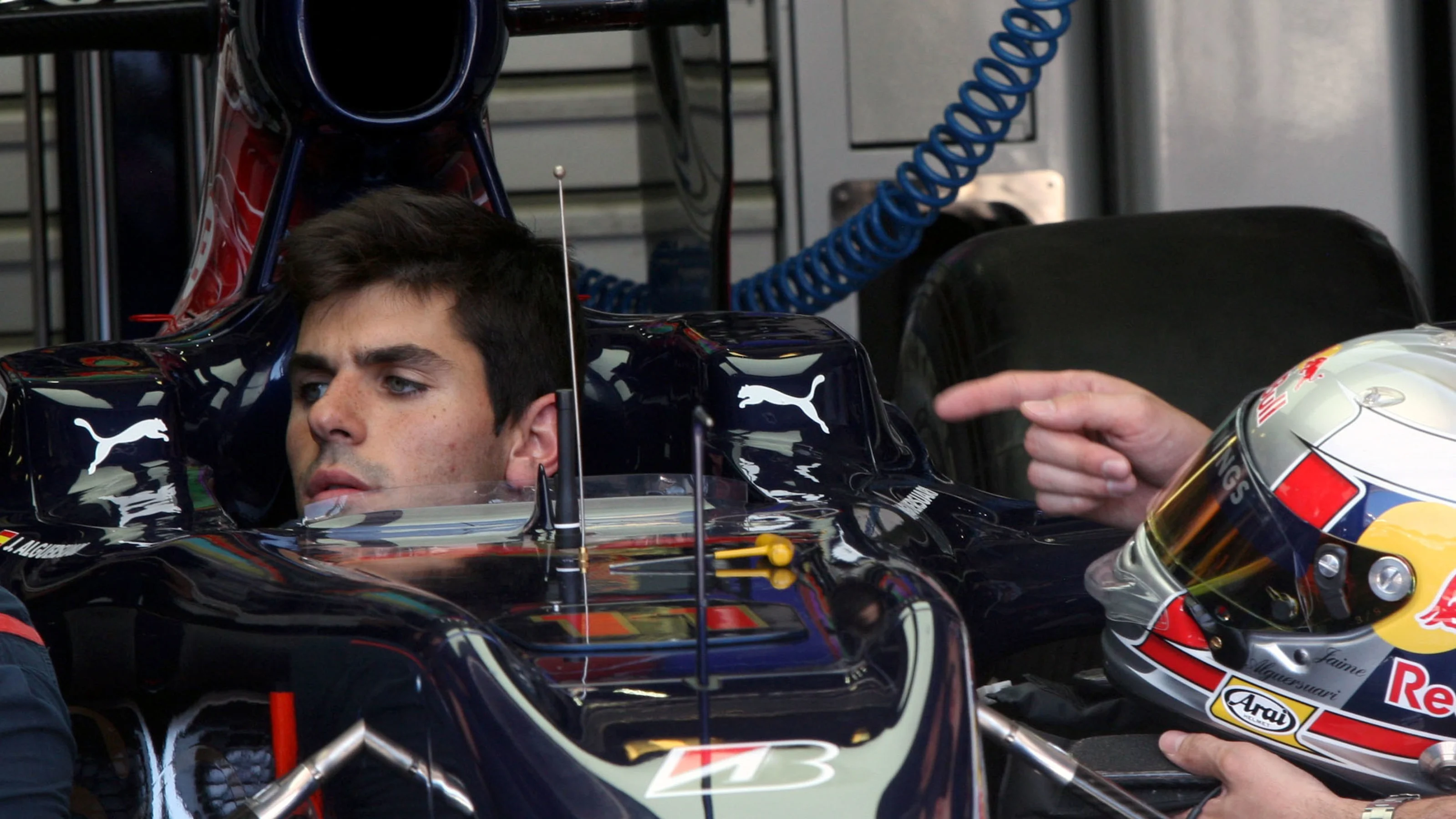 Jaime Alguersuari (ESP) Scuderia Toro Rosso checks his driving position with engineers. Formula