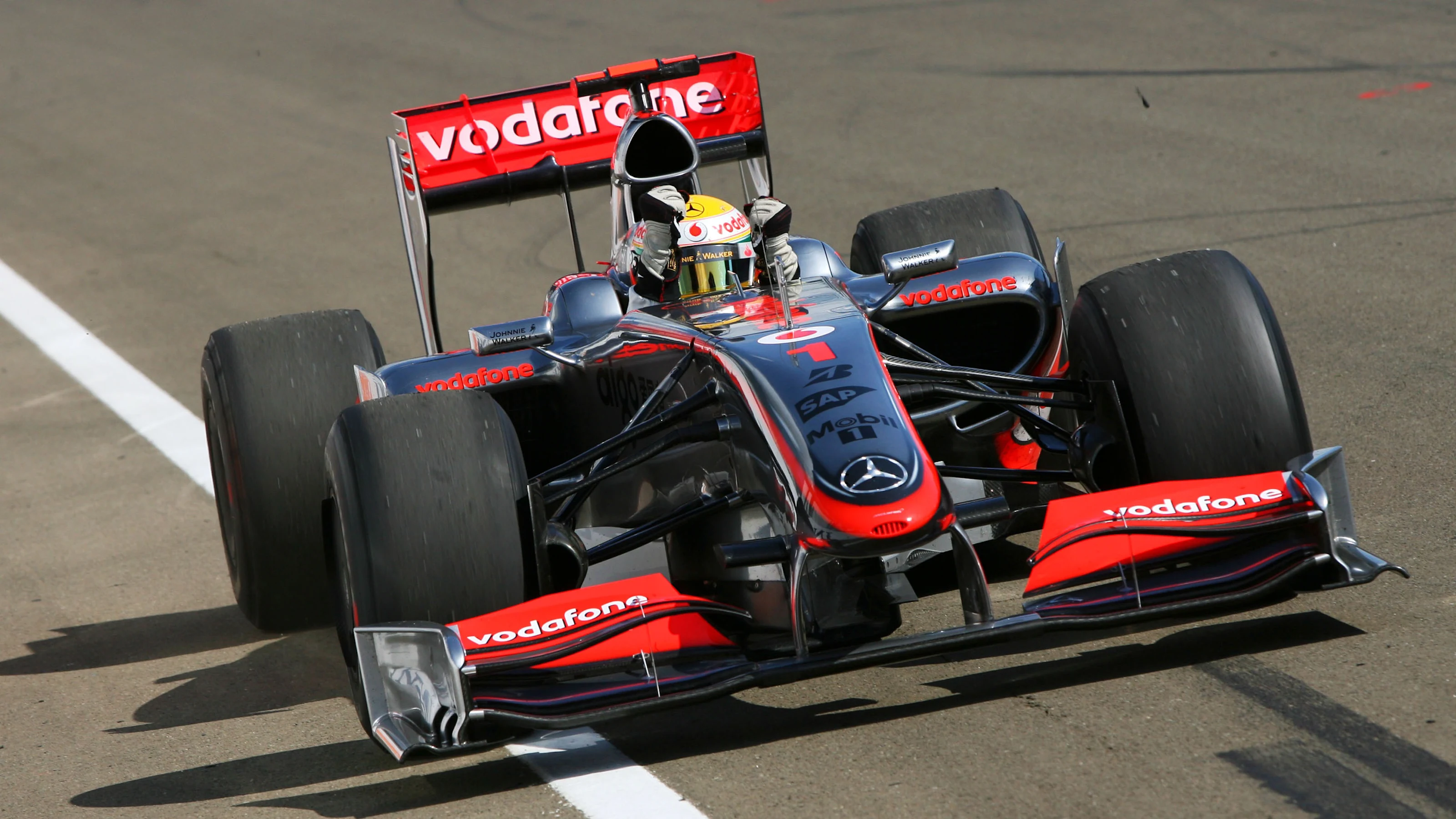 Race winner Lewis Hamilton (GBR) McLaren MP4/24 celebrates at the end of the race. Formula One