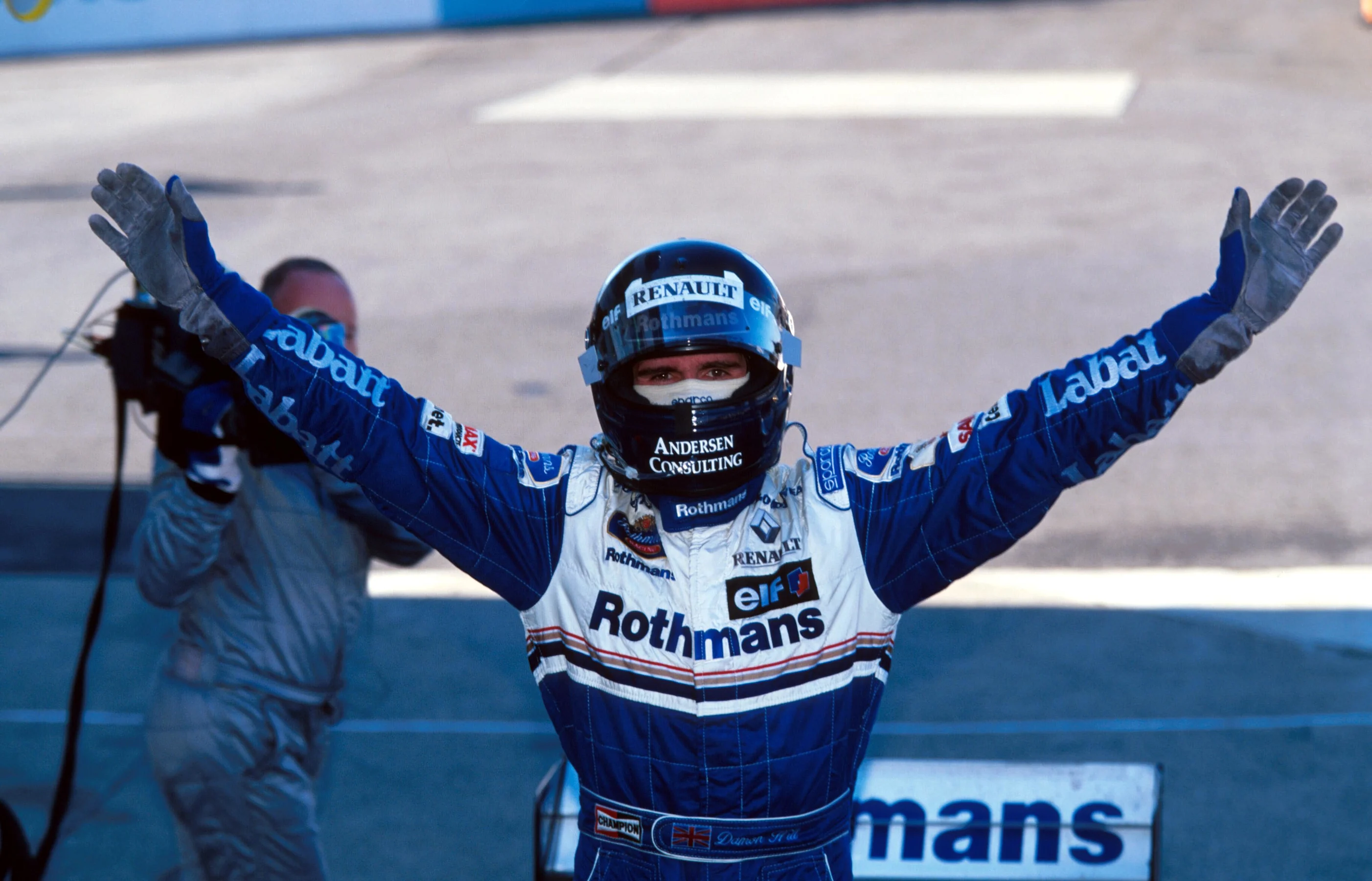 Race winner Damon Hill (GBR) Williams FW18 is able to celebrate his winning of the world