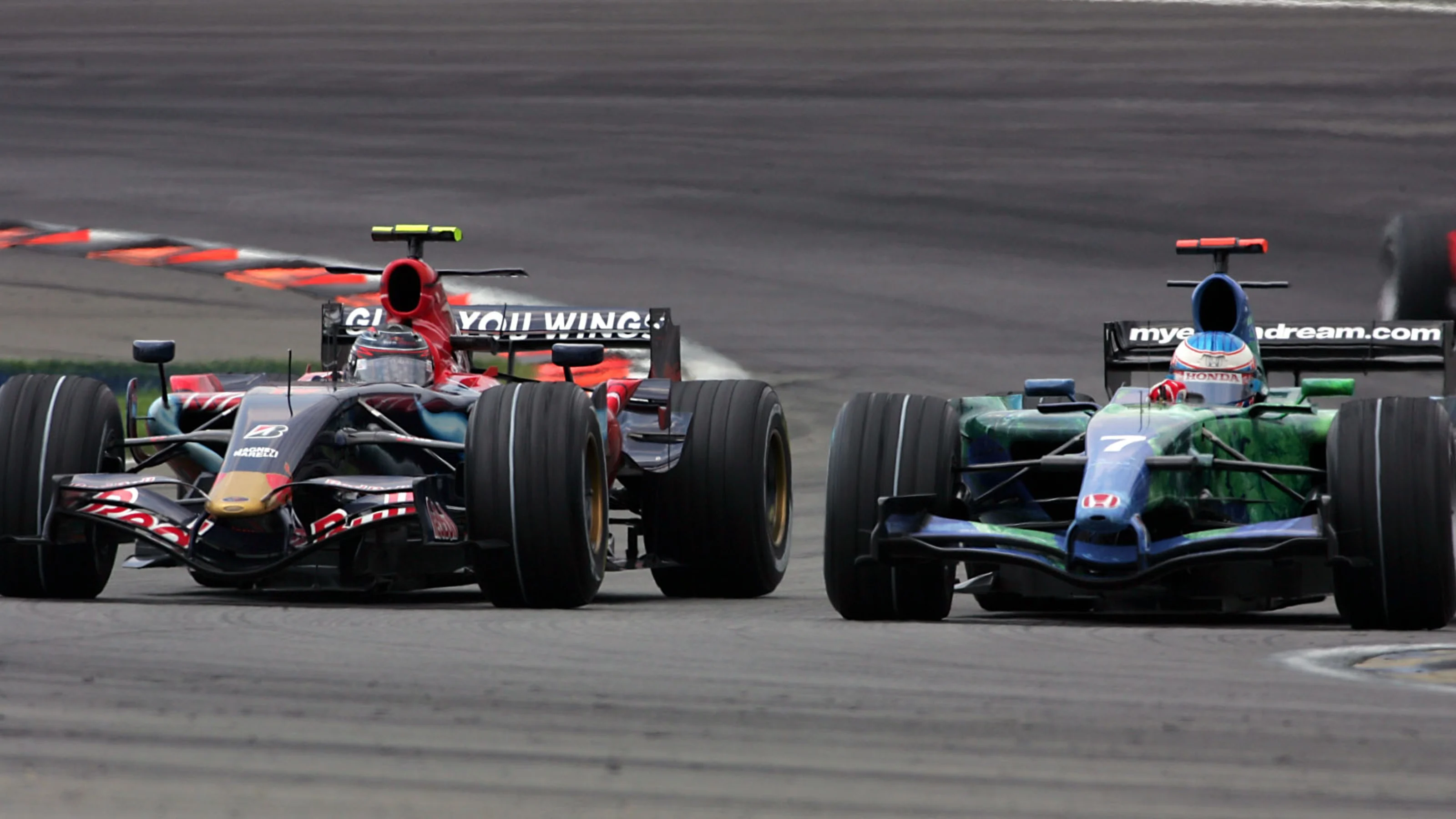 Scott Speed (USA) Scuderia Toro Rosso STR2 battles with Jenson Button (GBR) Honda RA107. Formula