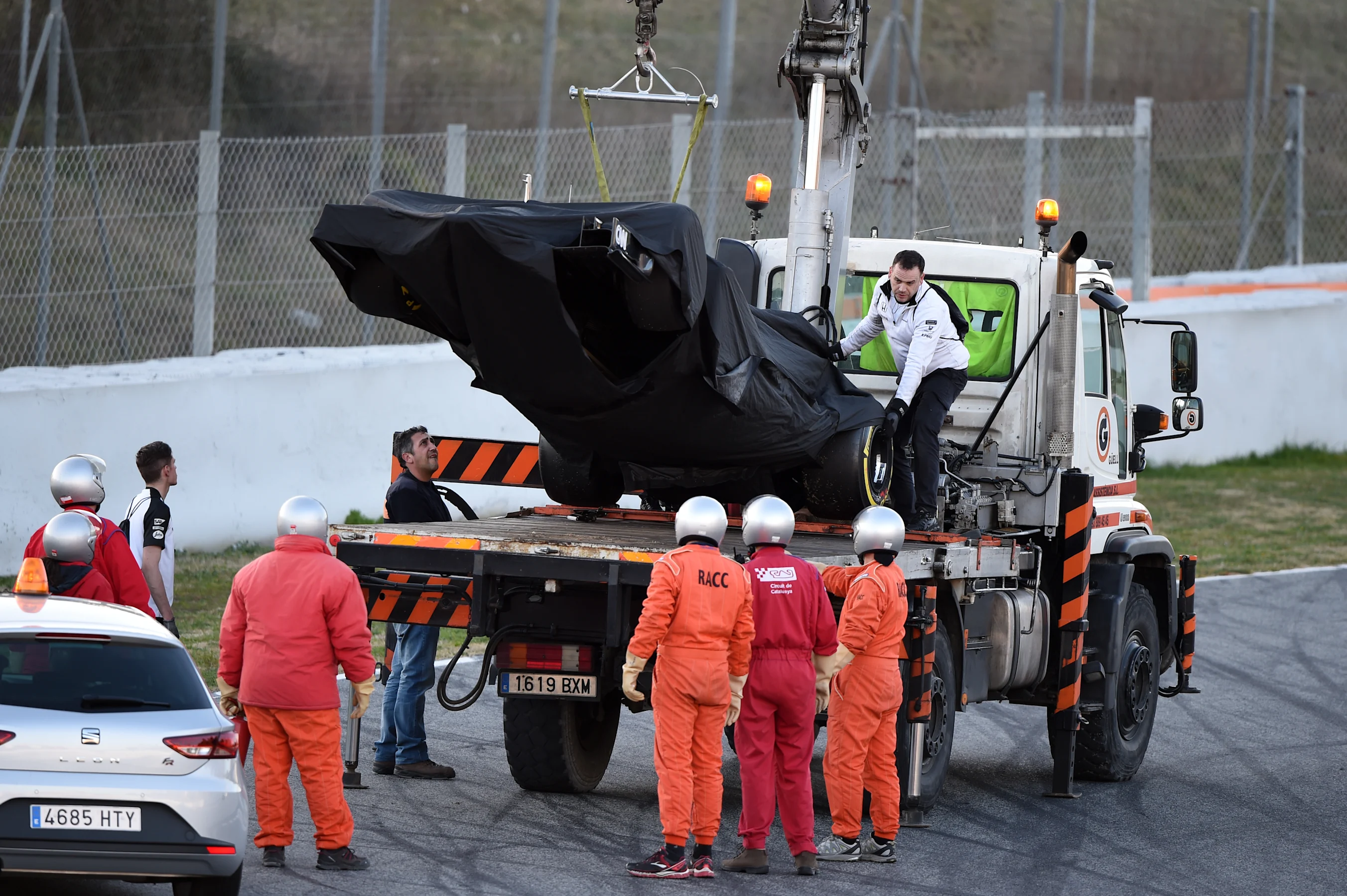 The car of Jenson Button (GBR) McLaren MP4-30 is recovered after stopping on track at Formula One