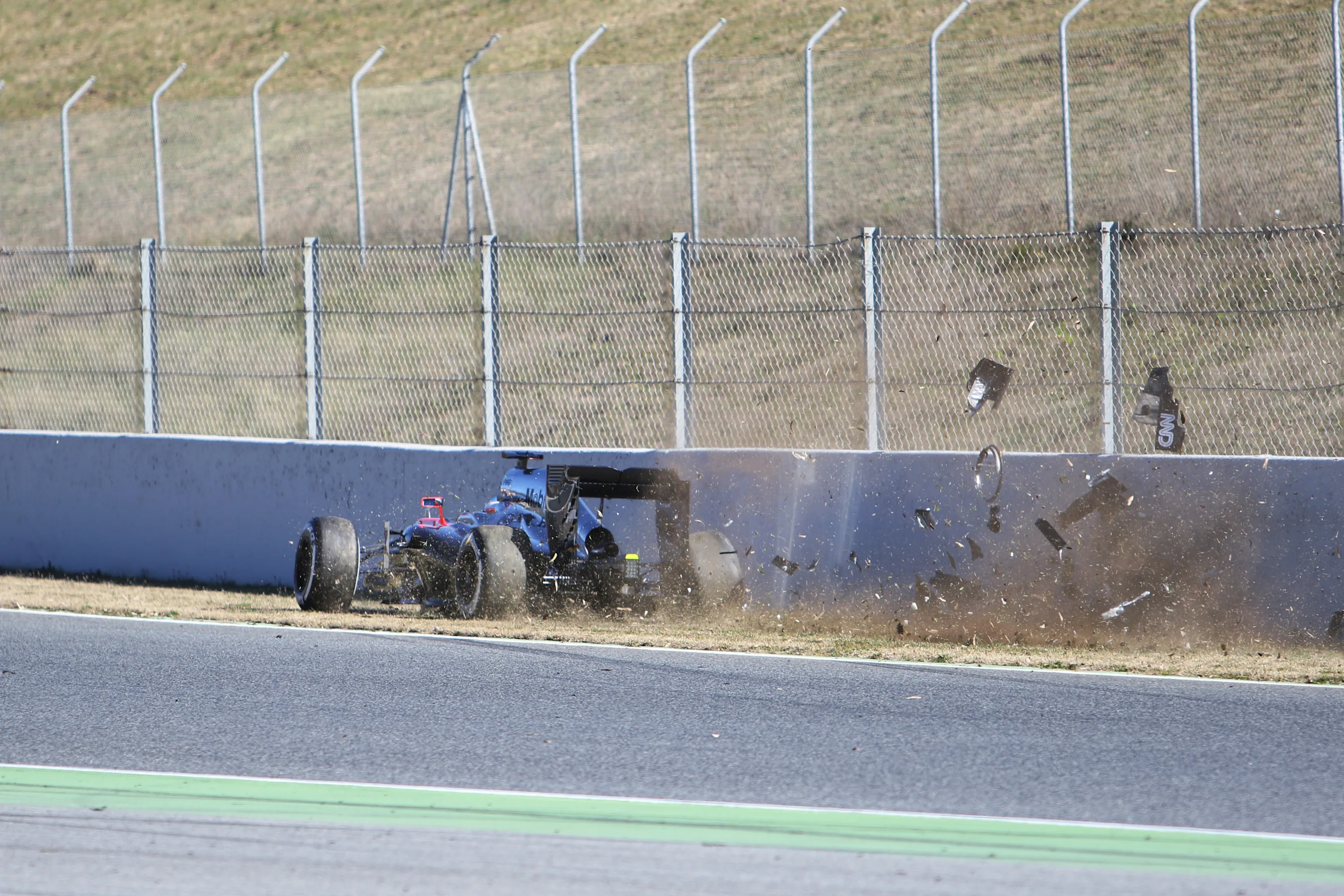 Fernando Alonso (ESP) McLaren MP4-30 crashes at Formula One Testing, Day Four, Barcelona, Spain, 22