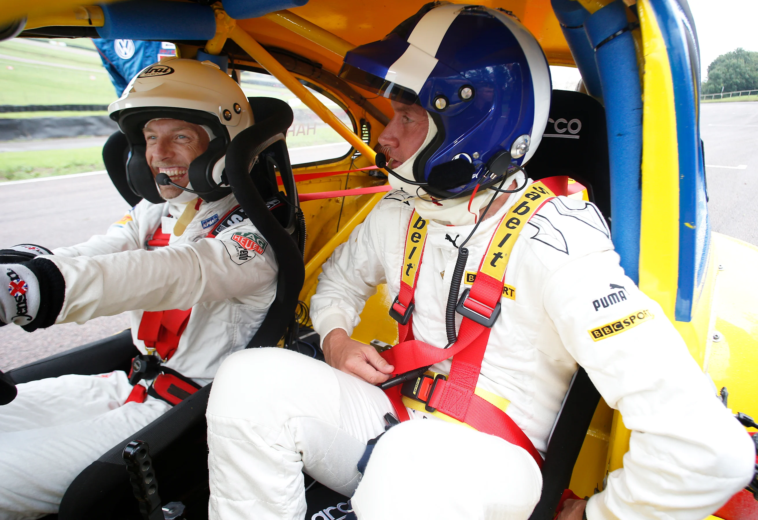 McLaren's Jenson Button (left) samples a 1974 VW Beetle - similar to the car that his late father