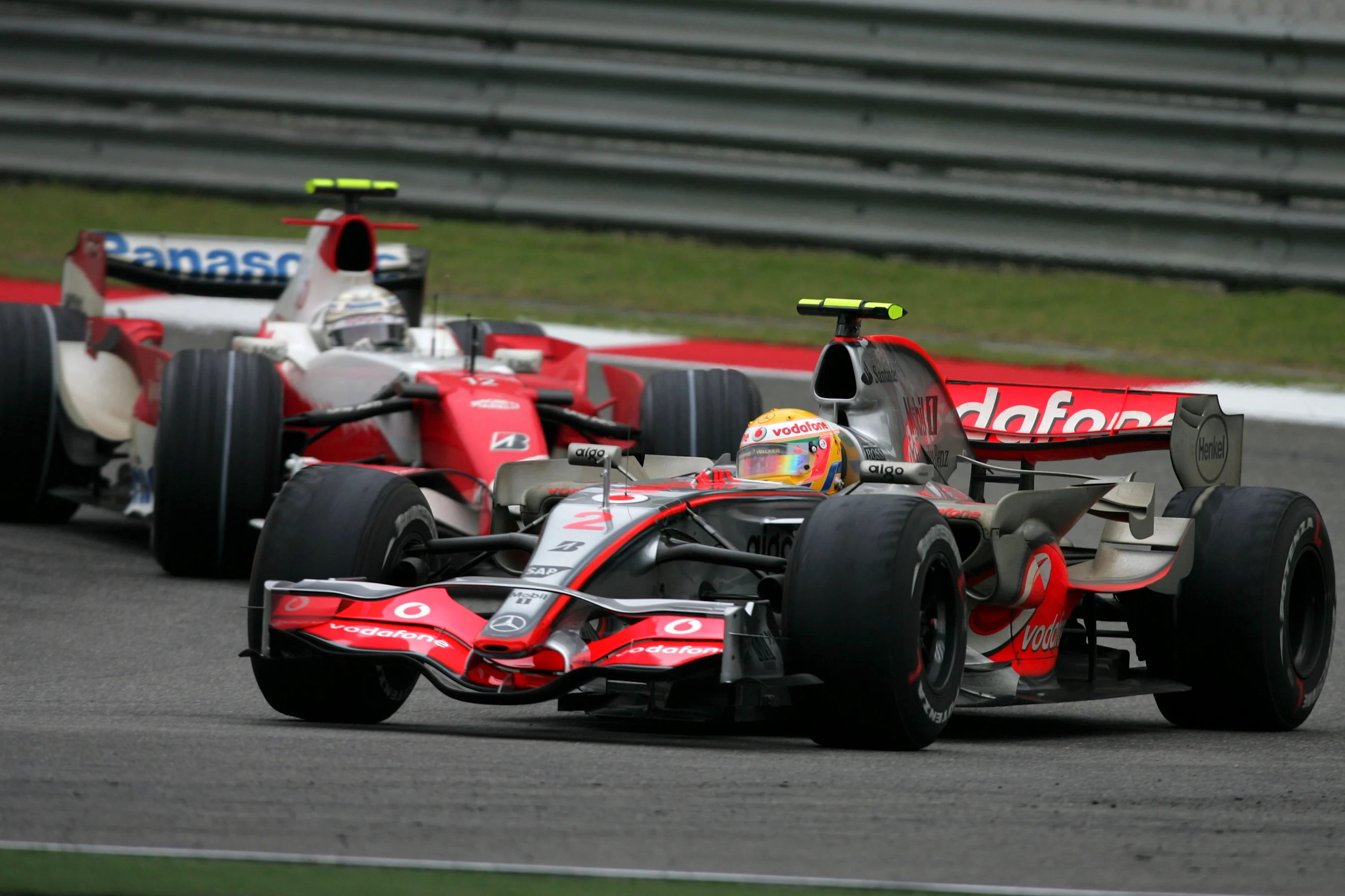Lewis Hamilton (GBR) McLaren Mercedes MP4/22 ahead of Jarno Trulli (ITA) Toyota TF107   Formula