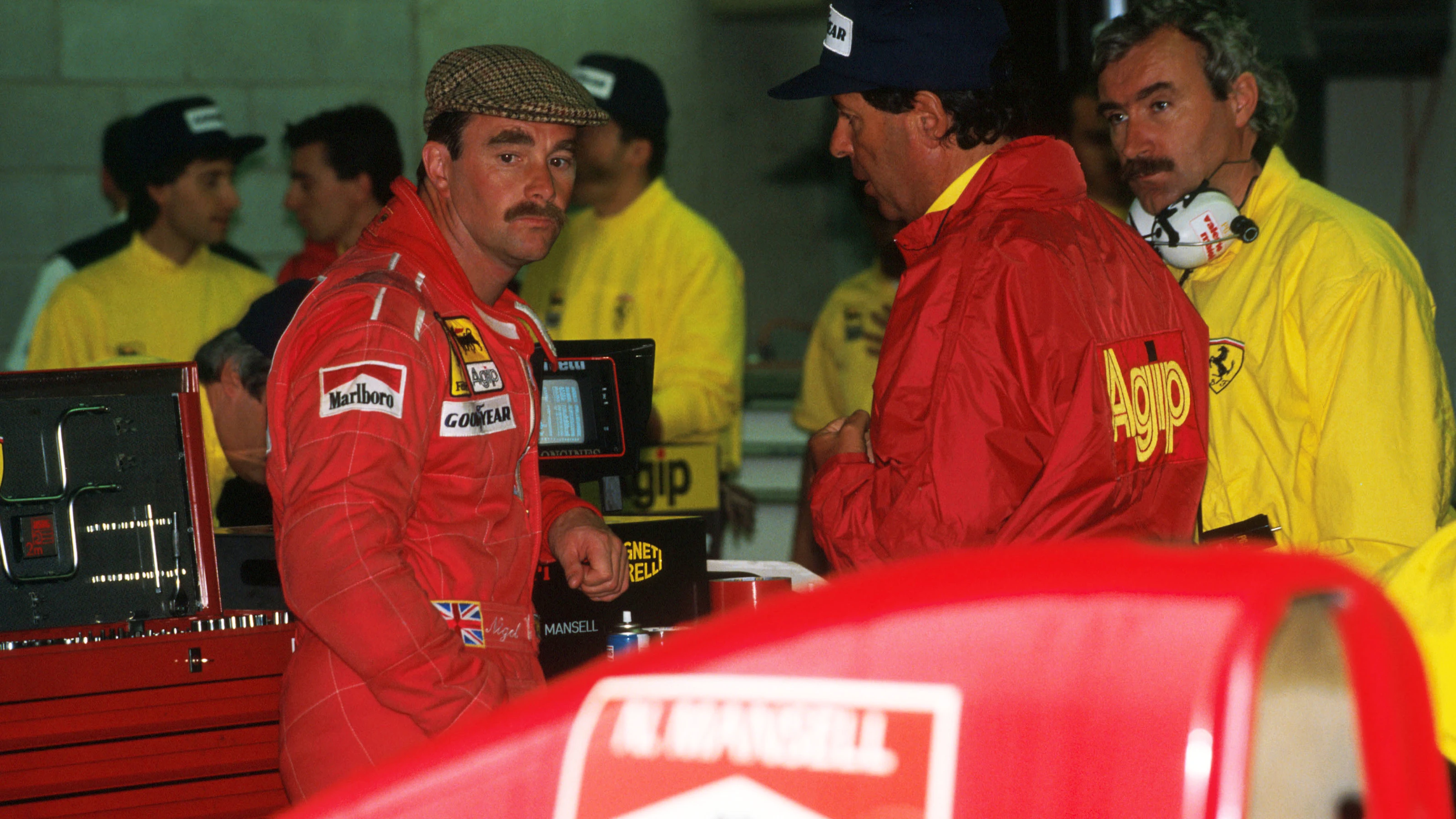 Nigel Mansell (GBR) Ferrari 641 and Cesare Fiorio,Ferrari Team Manager, right\rCanadian Grand Prix,