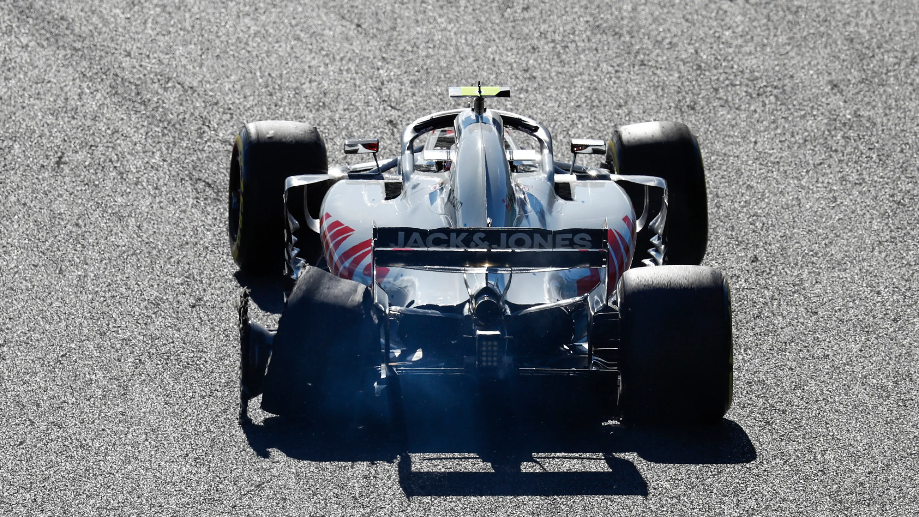 SUZUKA, JAPAN - OCTOBER 07: Kevin Magnussen, Haas F1 Team VF-18, with his rear tyre burst after