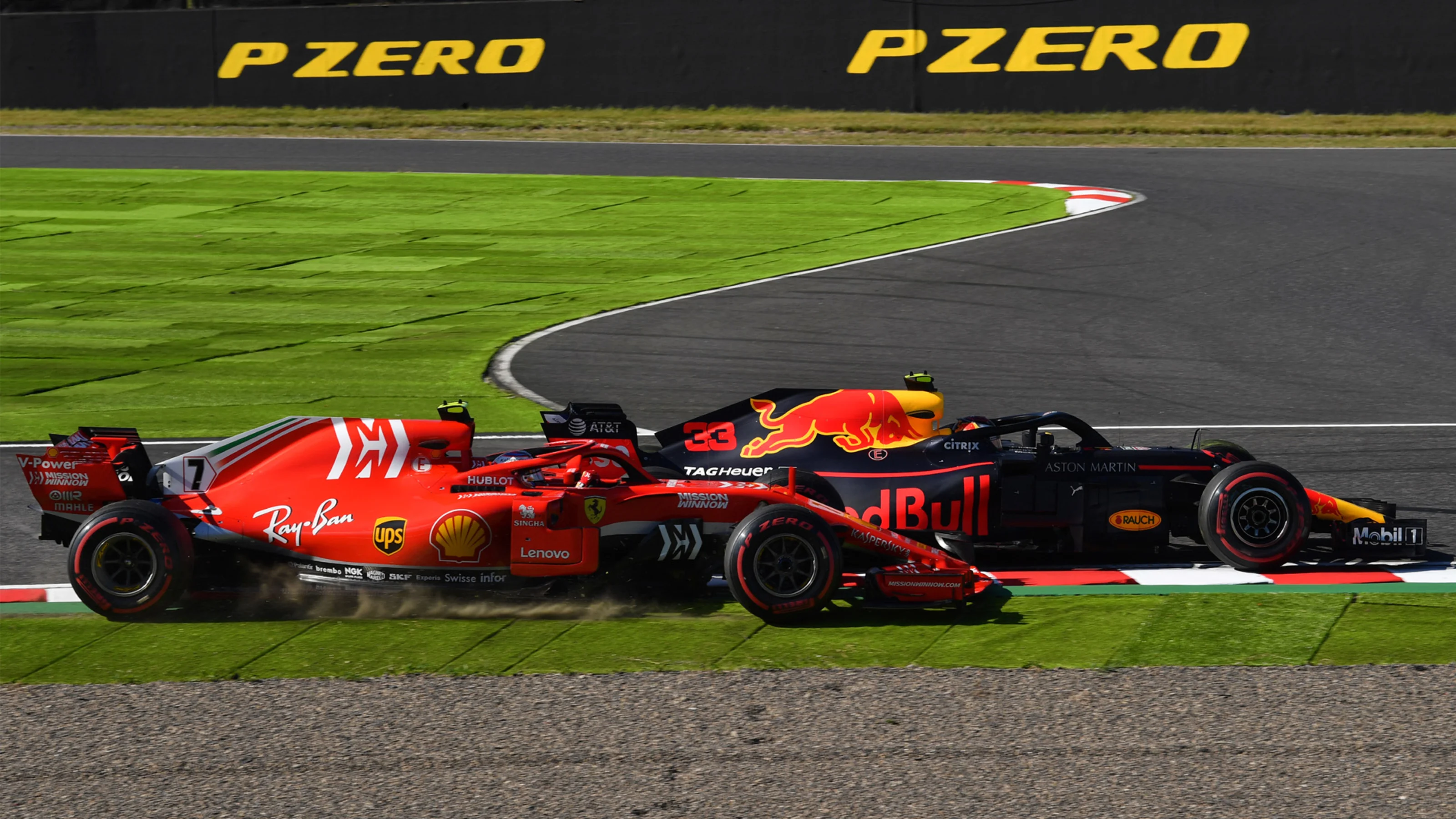 SUZUKA, JAPAN - OCTOBER 07: Kimi Raikkonen, Ferrari SF71H and Max Verstappen, Red Bull Racing RB14