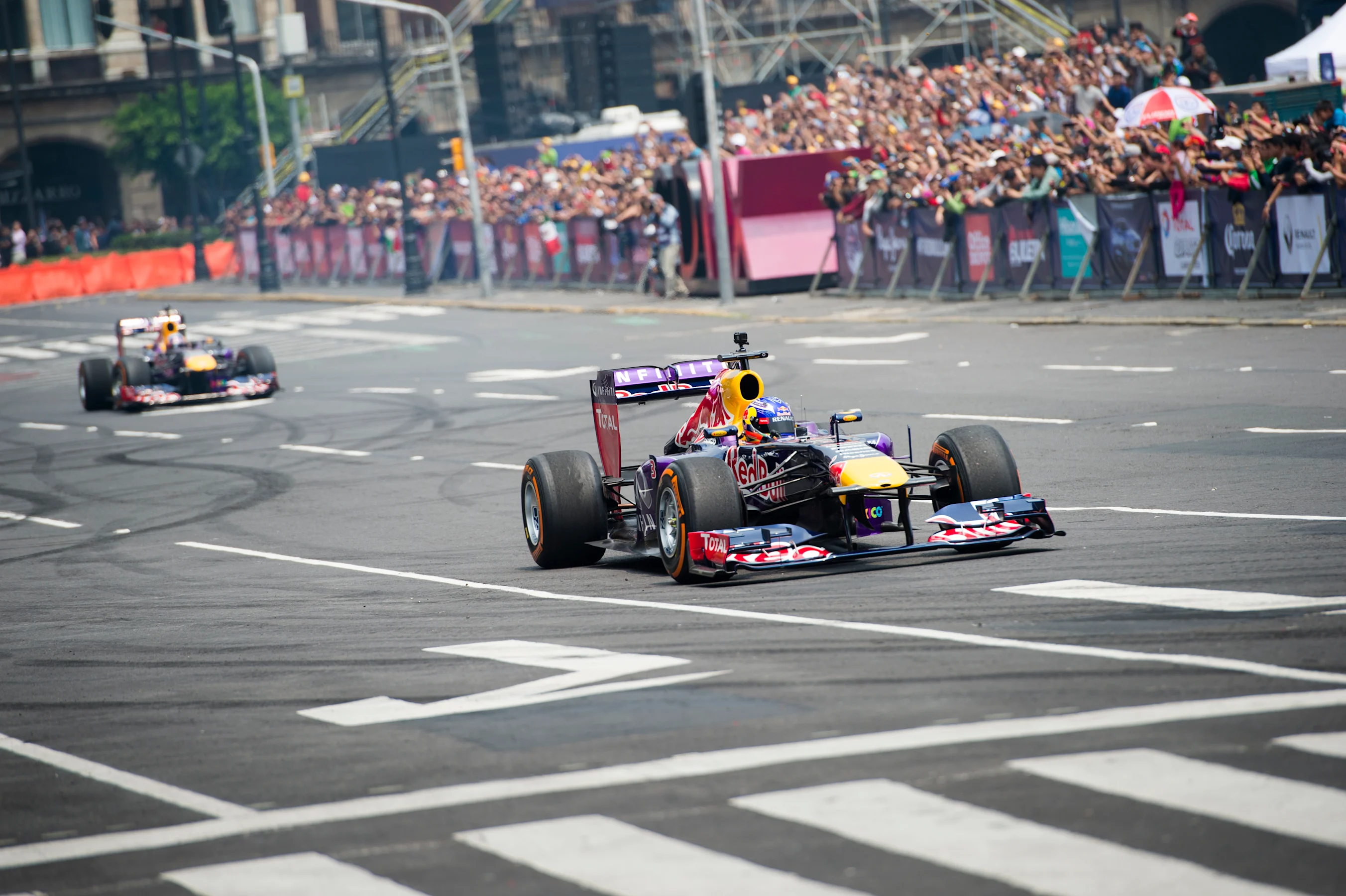 Daniel Ricciardo and Carlos Sainz performs during Infiniti Red Bull Racing F1 Show Run at the