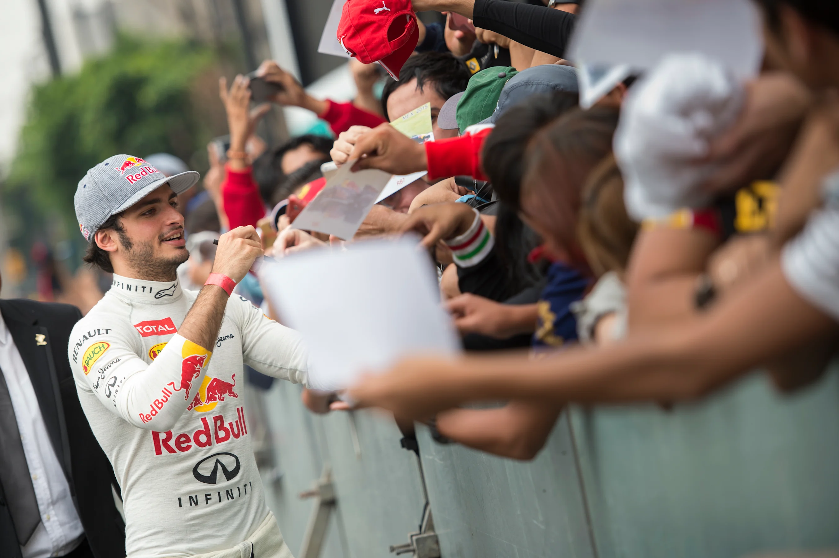 Carlos Sainz signs autographs during Infiniti Red Bull Racing F1 Show Run at the Zocalo Plaza in