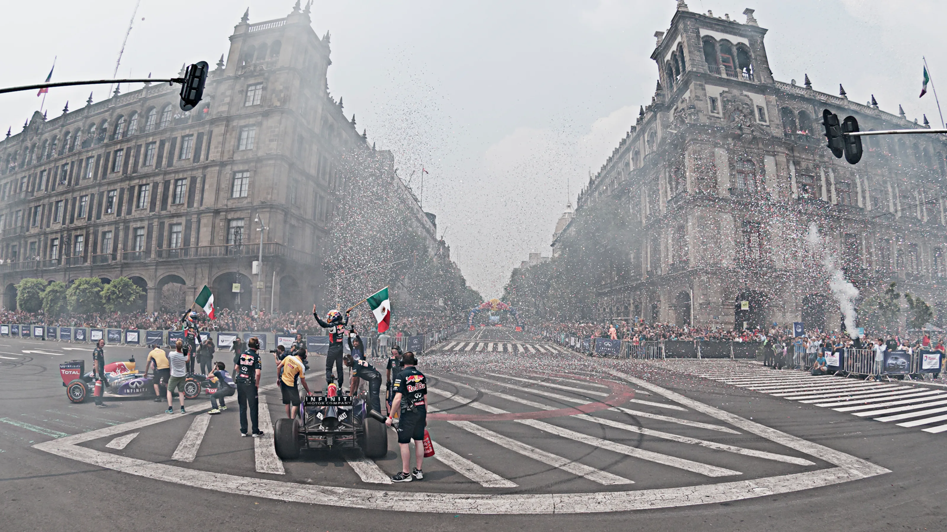 Carlos Sainz and Daniel Ricciardo saluting the crowd after finishing their performance during the