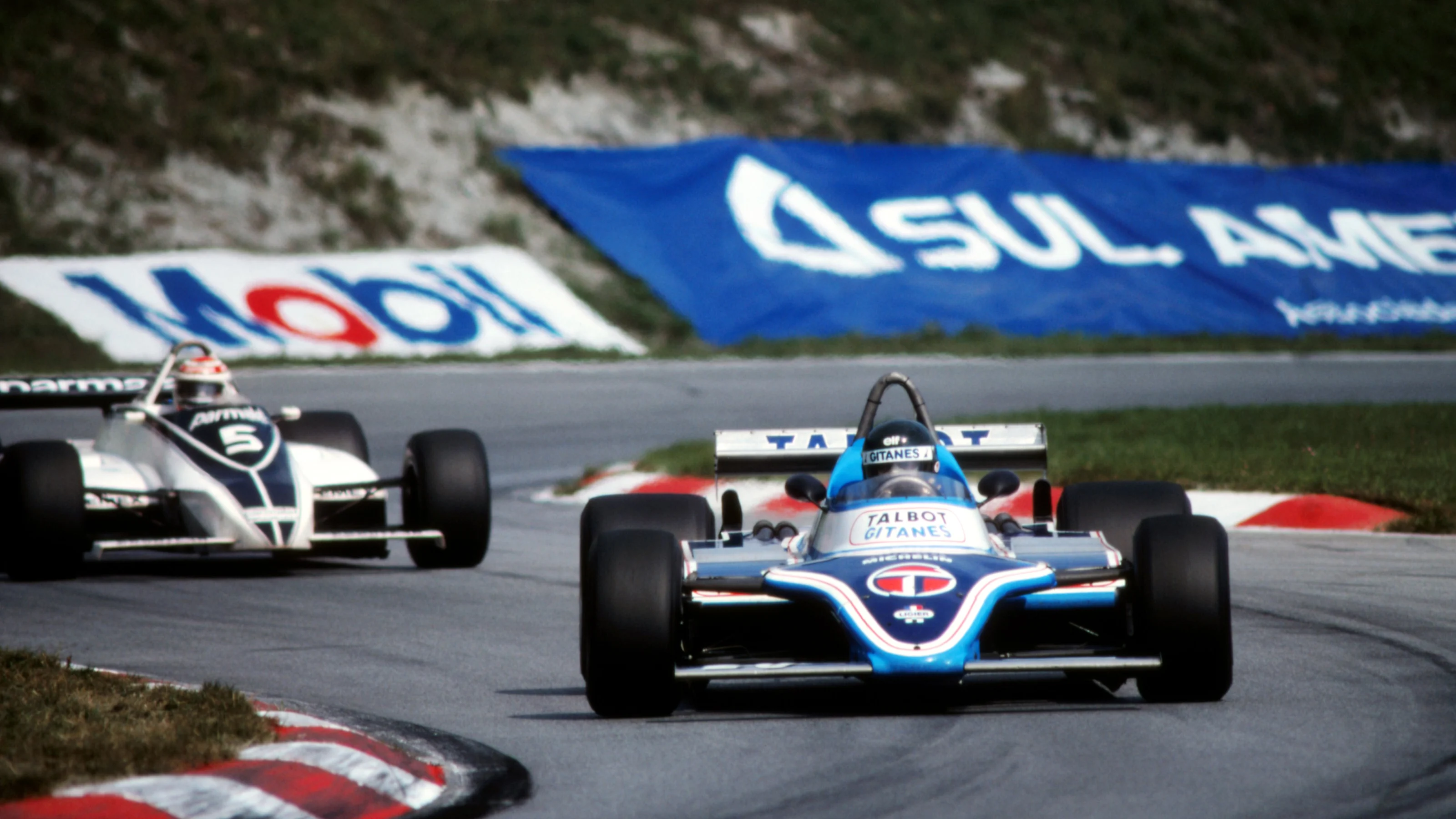 Race winner Jacques Laffite (FRA), Ligier JS17, followed by Nelson Piquet (BRA), Brabham