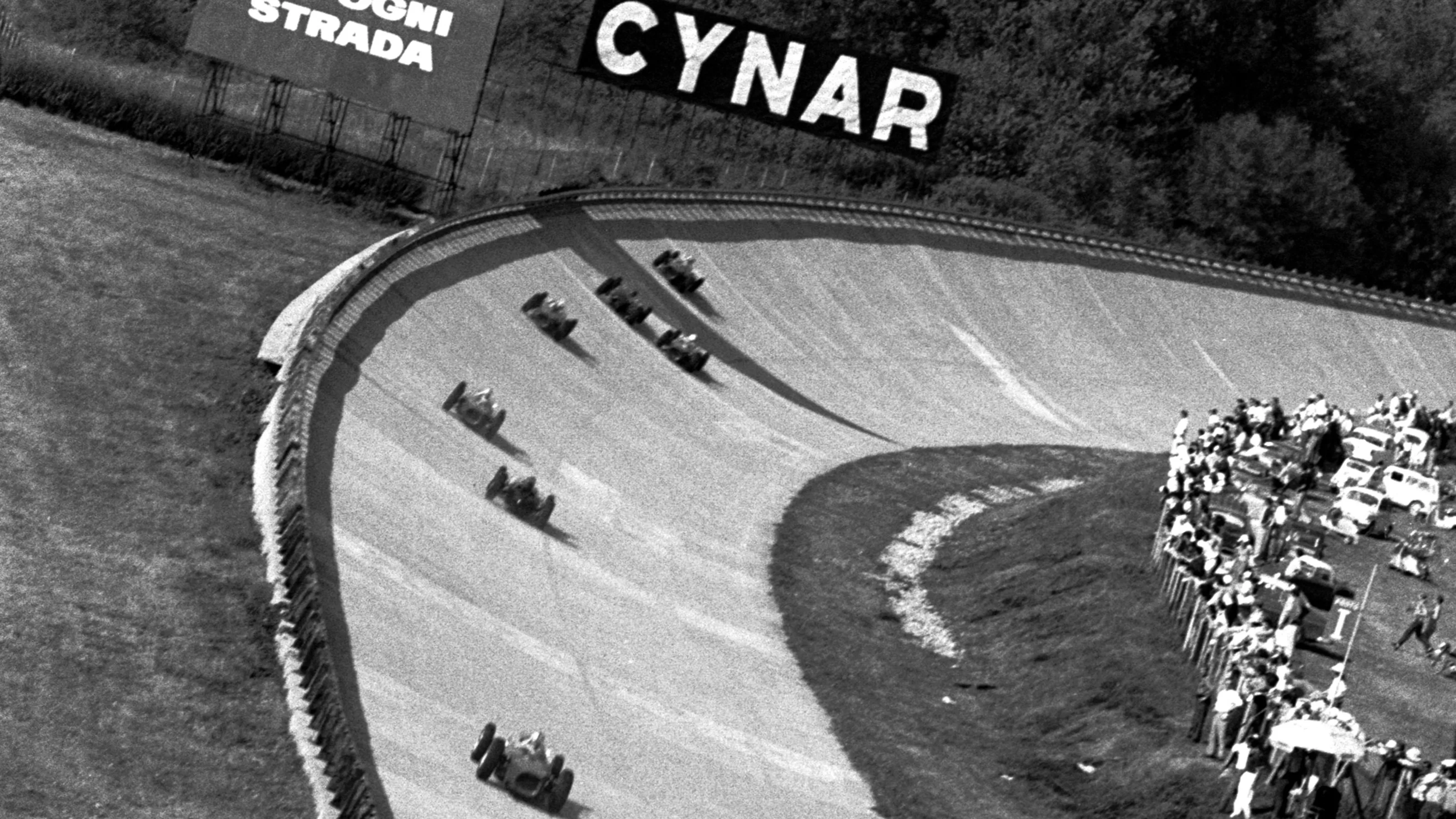 The field head around the notorious Monza banking - used for the last time in a Formula One event.