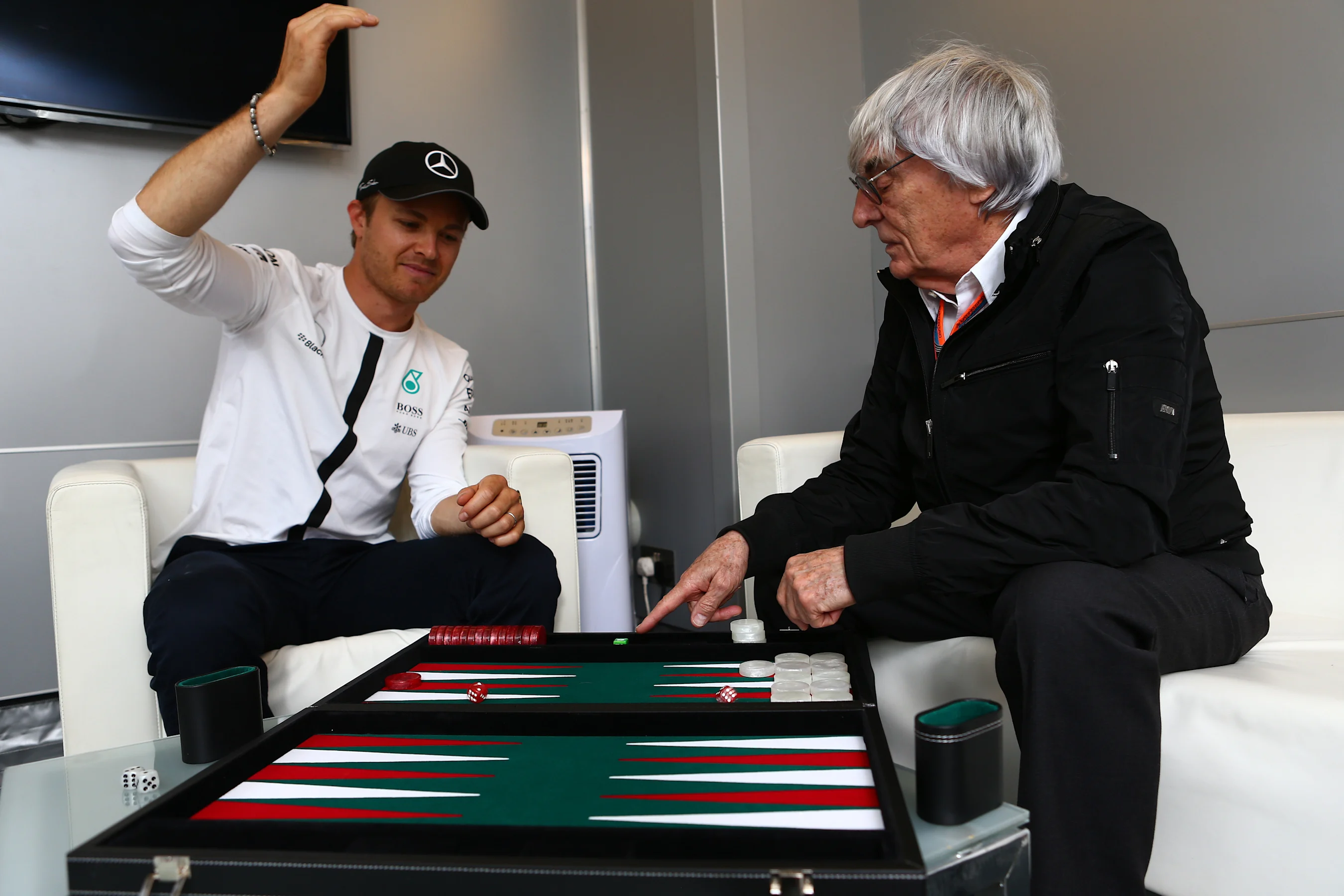 Mercedes' Nico Rosberg in conversation with Formula One group CEO Bernie Ecclestone, Monaco, May