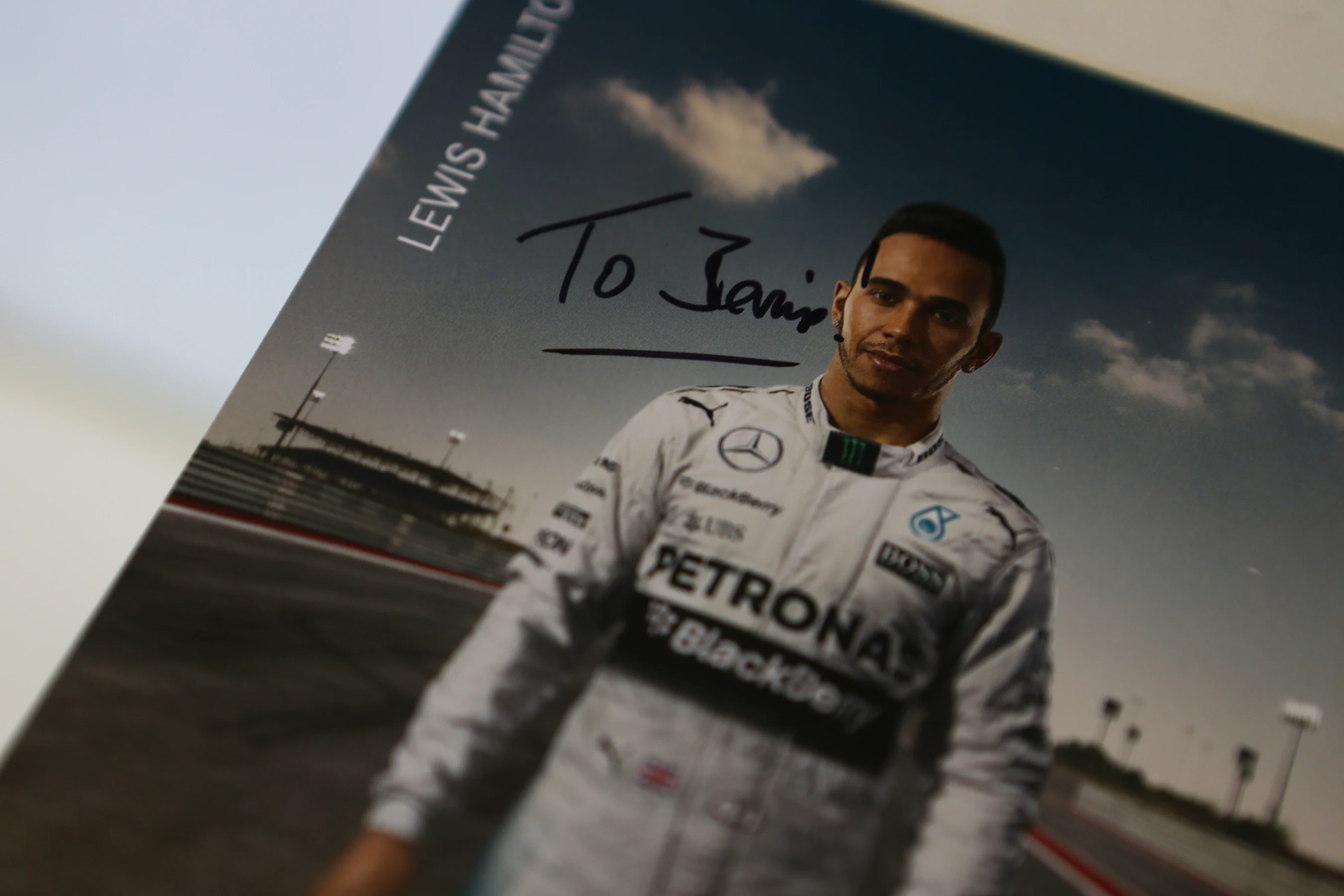 A signed Lewis Hamilton autograph card, dedicated to Formula One group CEO Bernie Ecclestone