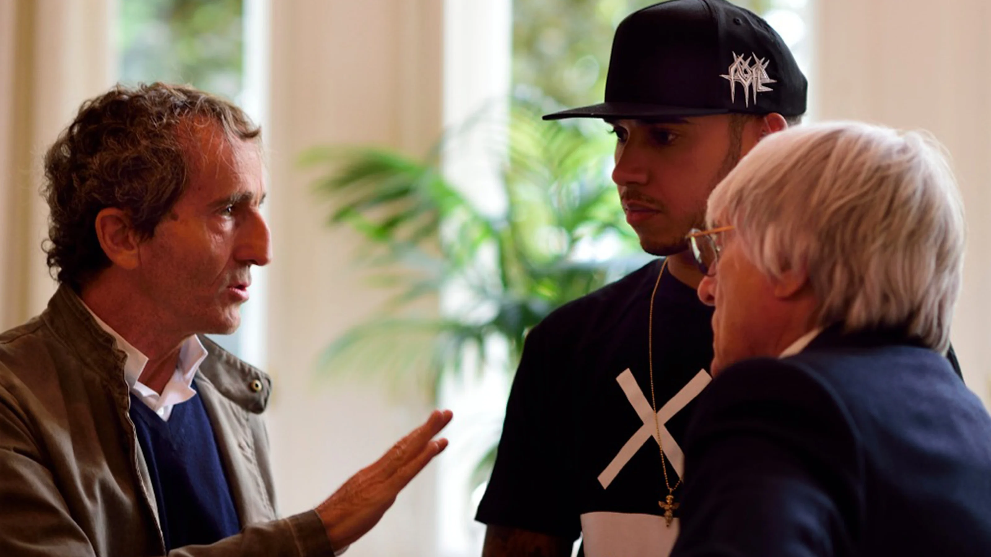 (L to R) Alain Prost, Lewis Hamilton, Bernie Ecclestone