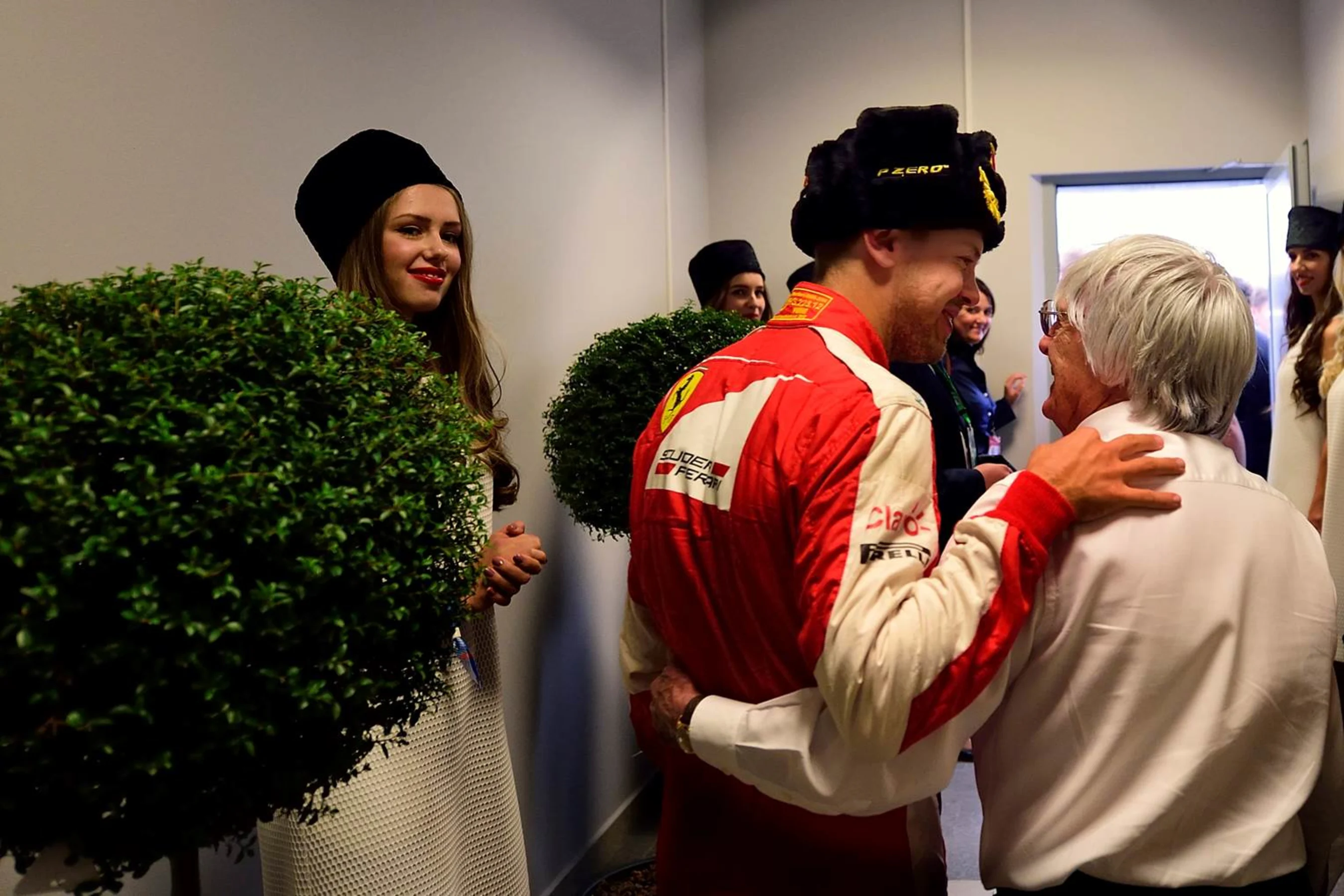 Formula One group CEO Bernie Ecclestone with Ferrari's Sebastian Vettel at the 2015 Formula 1