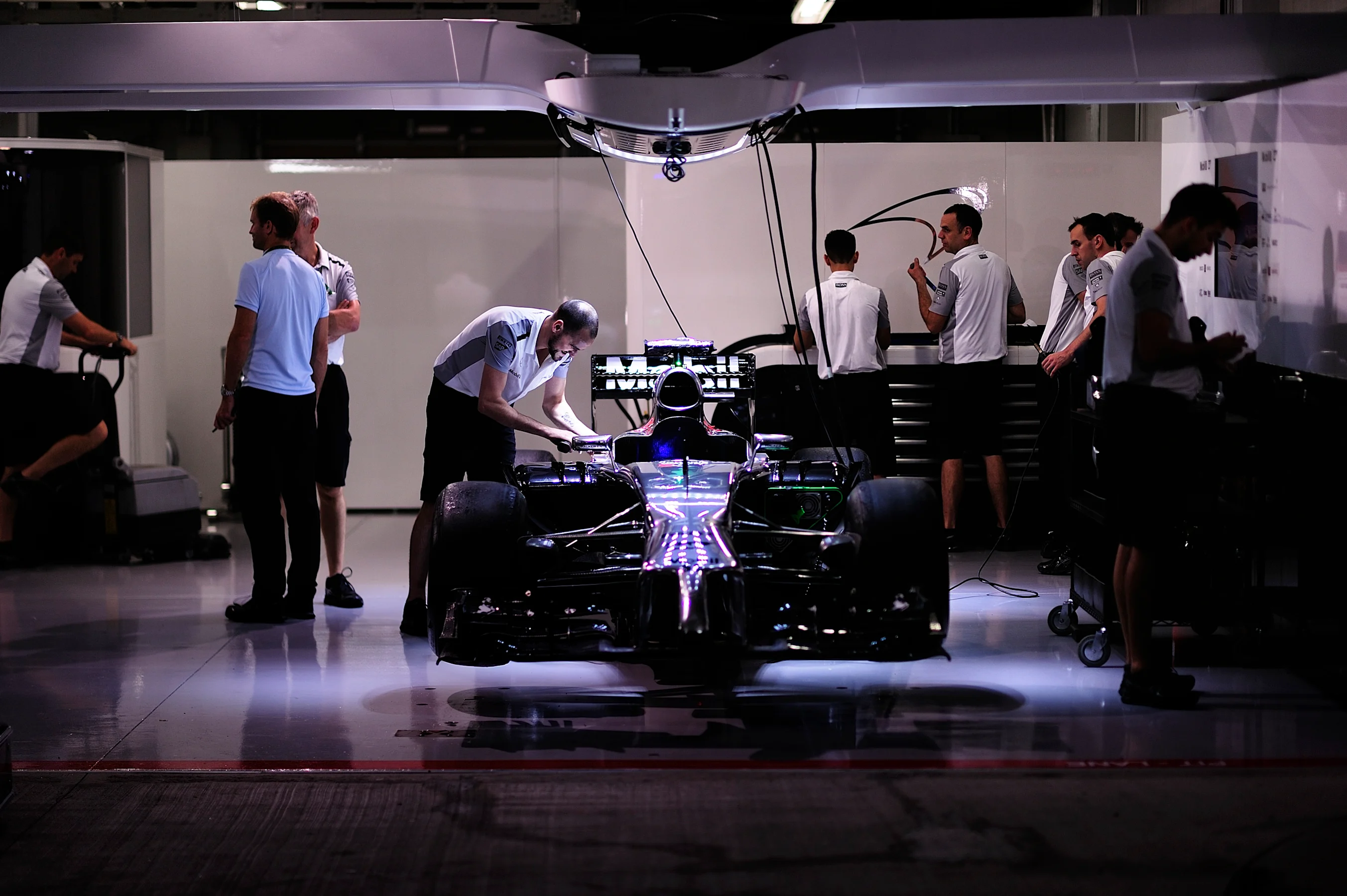 Evening preparations in the McLaren garage