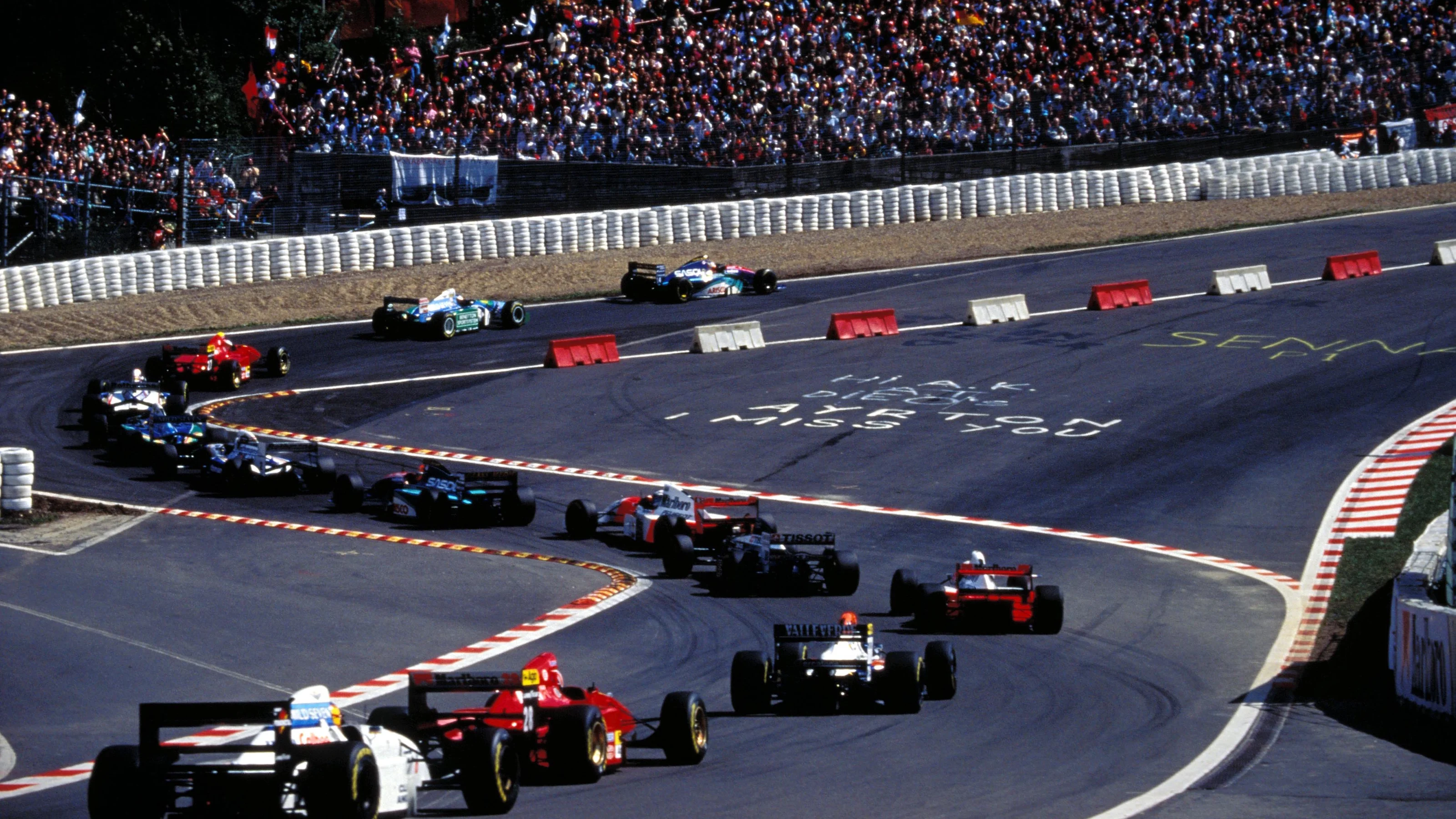 Rubens Barrichello (BRA) Jordan Hart 194 leads the field through the Eau Rouge chicane from his