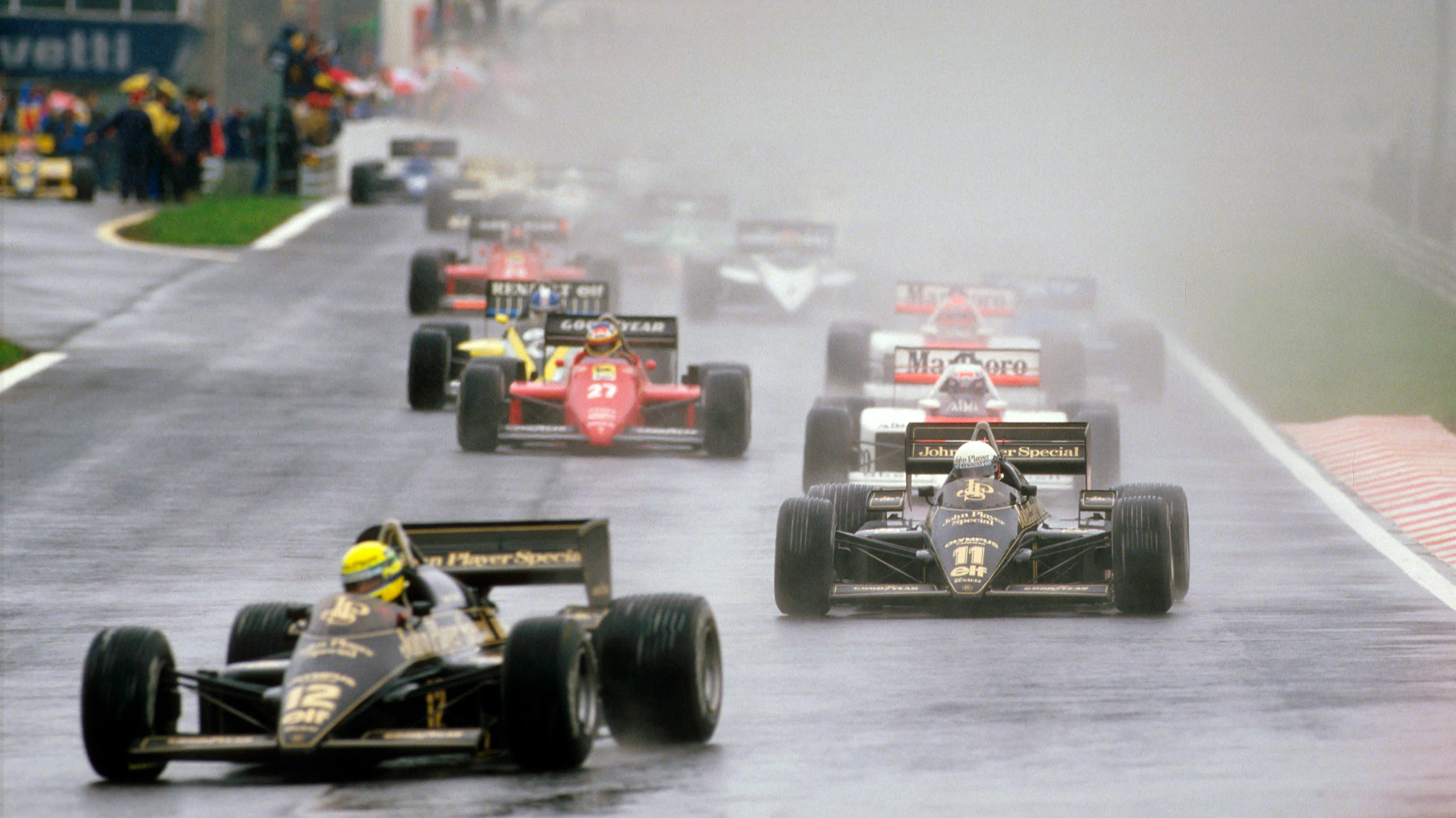 Estoril, Portugal. 19-21 April 1985. Ayrton Senna leads teammate Elio de Angelis (both Lotus 97T