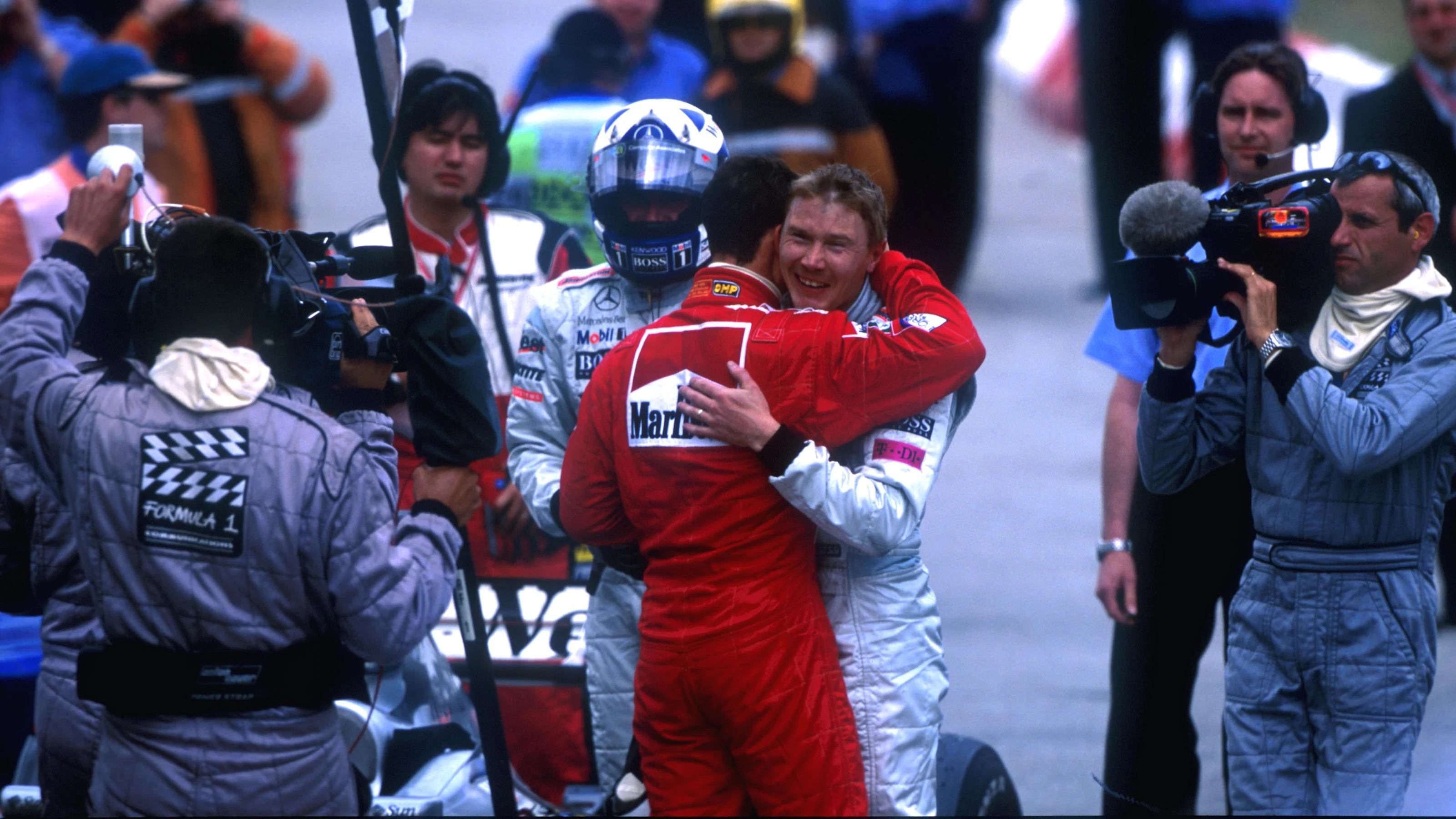 Winner Michael Schumacher(D) Ferrari F1 2001 hugs Mika Hakkinen(FIN) McLaren Mercedes