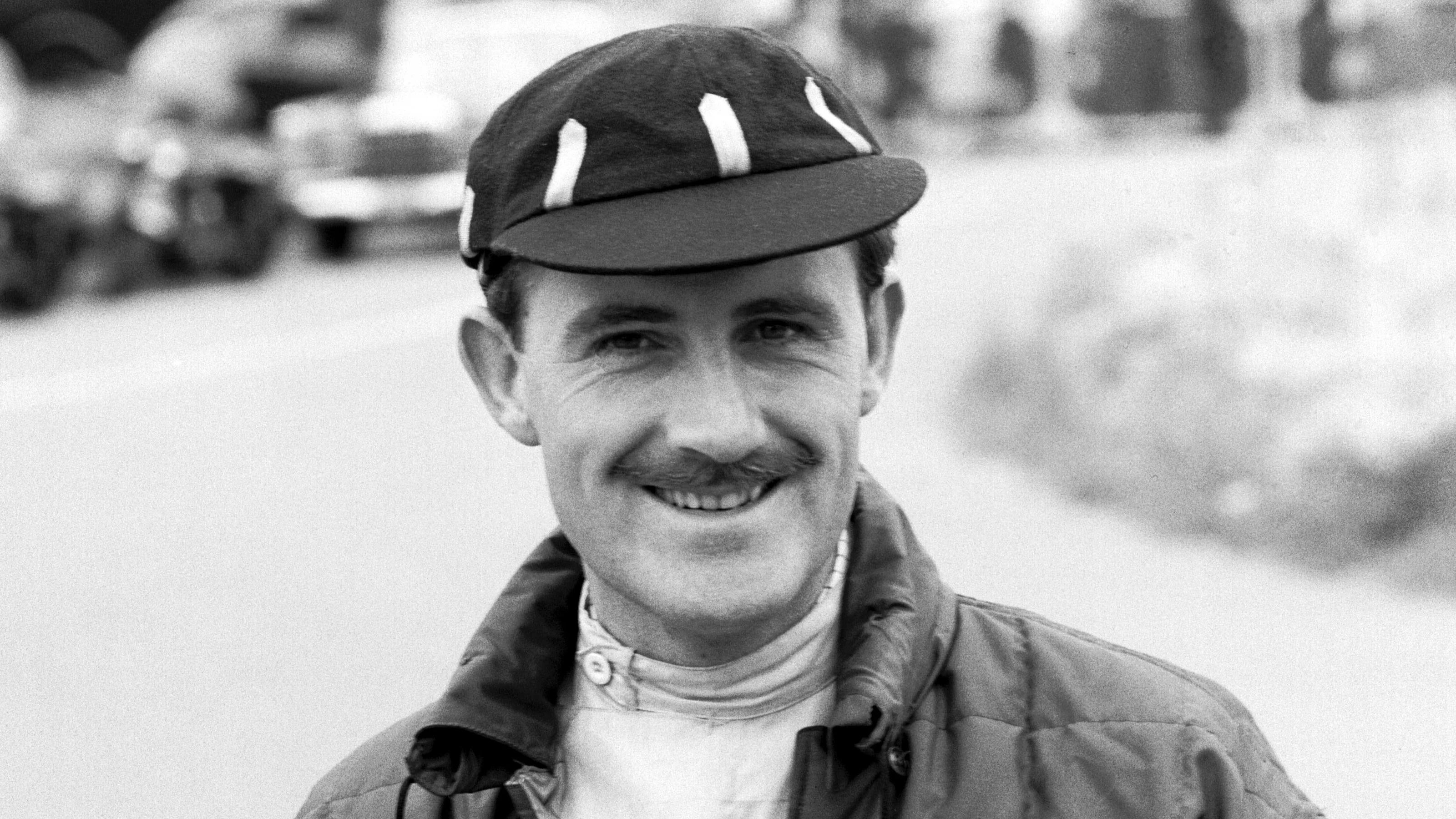 Graham Hill (GBR) BRM wearing a cap displaying the colours of the London Rowing Club. Belgian
