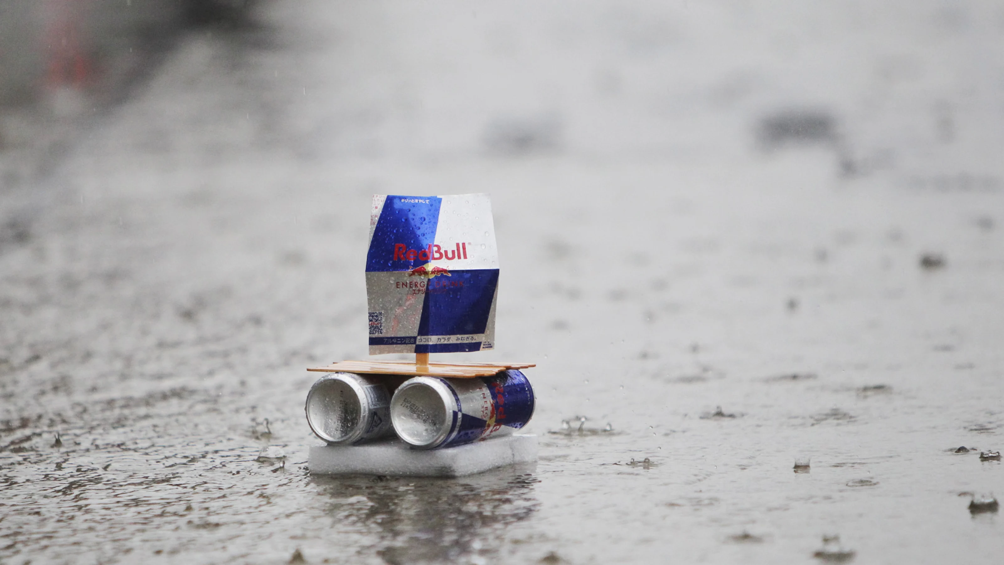 A Red Bull boat sails down the pitlane during heavy rain.   Formula One World Championship, Rd