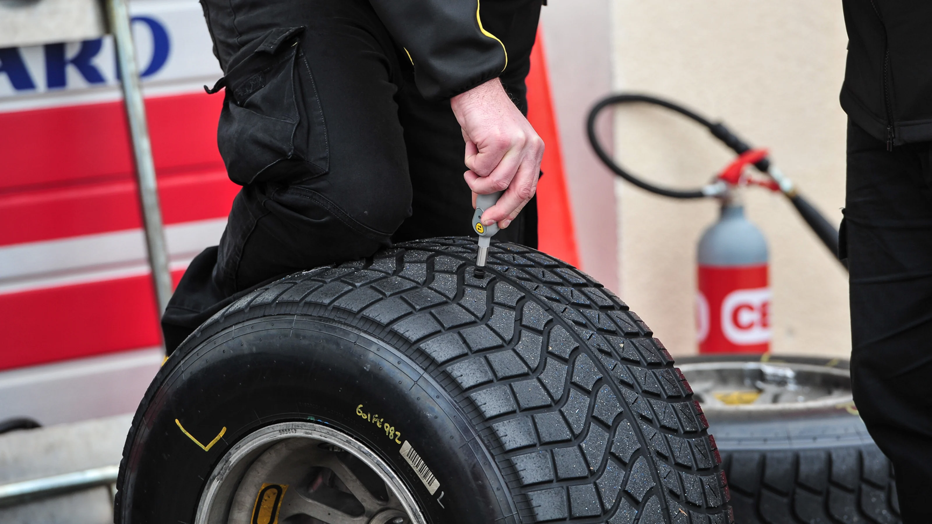 Pirelli engineers check tyre temperature at Pirelli Formula One Wet Test, Day One, Paul Ricard,