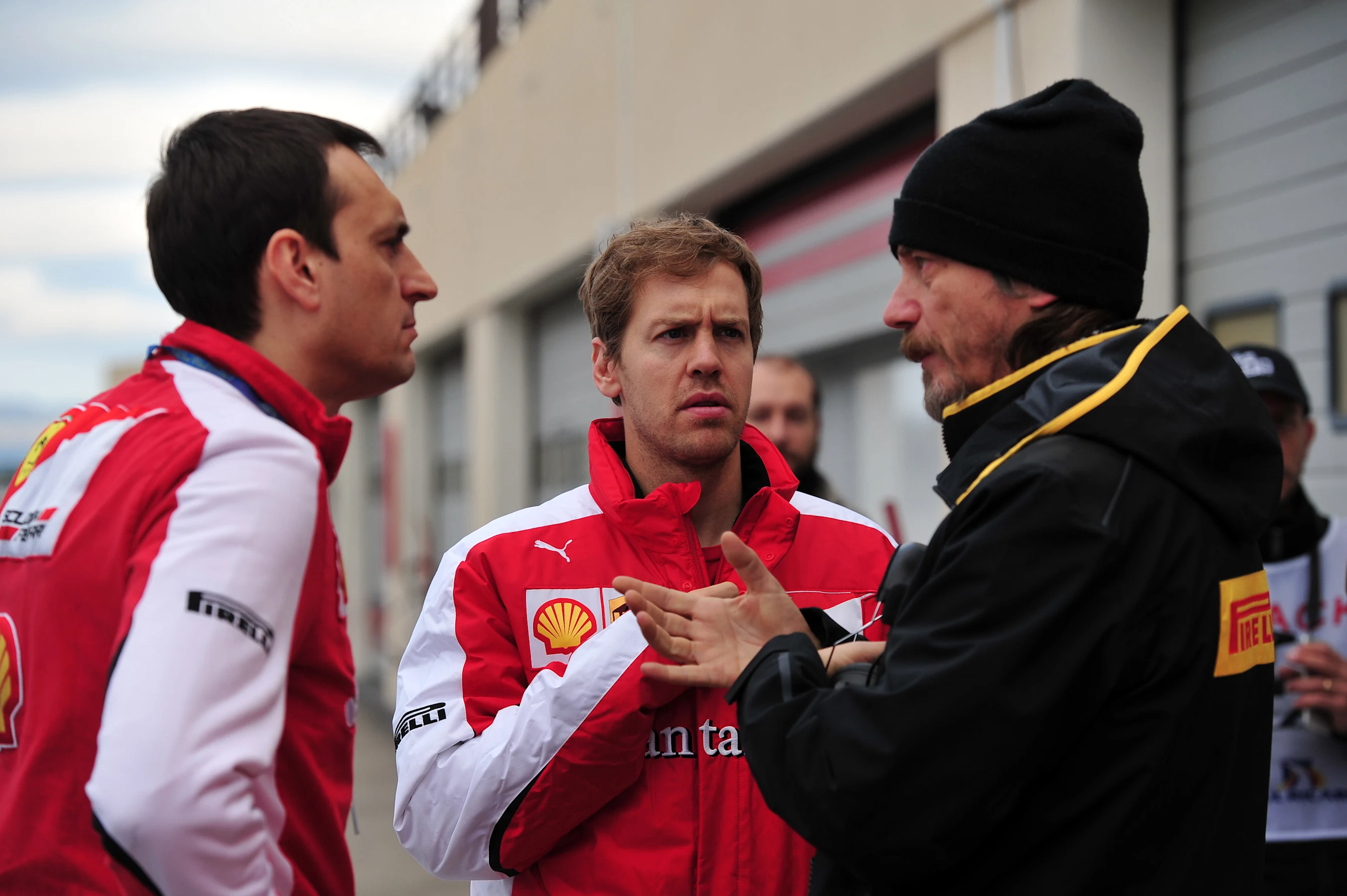 Riccardo Adami (ITA) Ferrari Race Engineer , Sebastian Vettel (GER) Ferrari and Pirelli engineer at