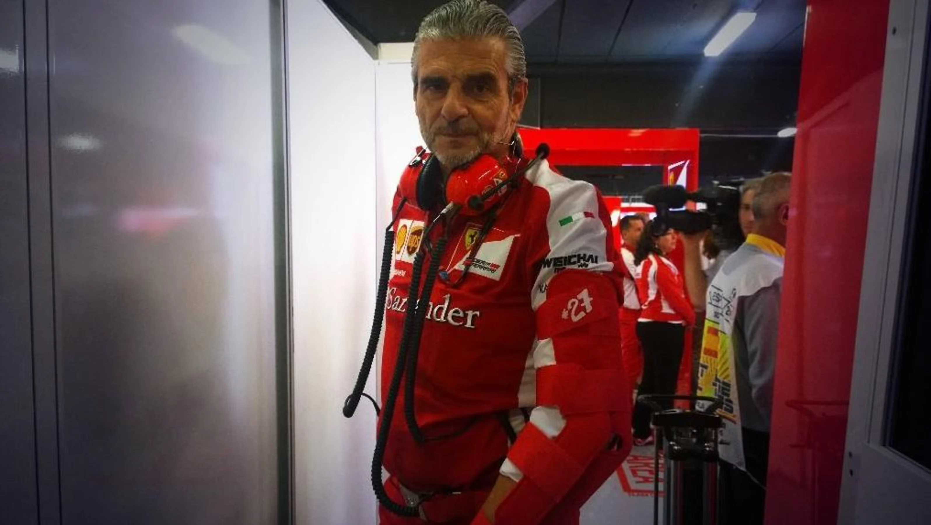 Ferrari team principal Maurizio Arrivabene wears a #27 armband to remember former driver Gilles