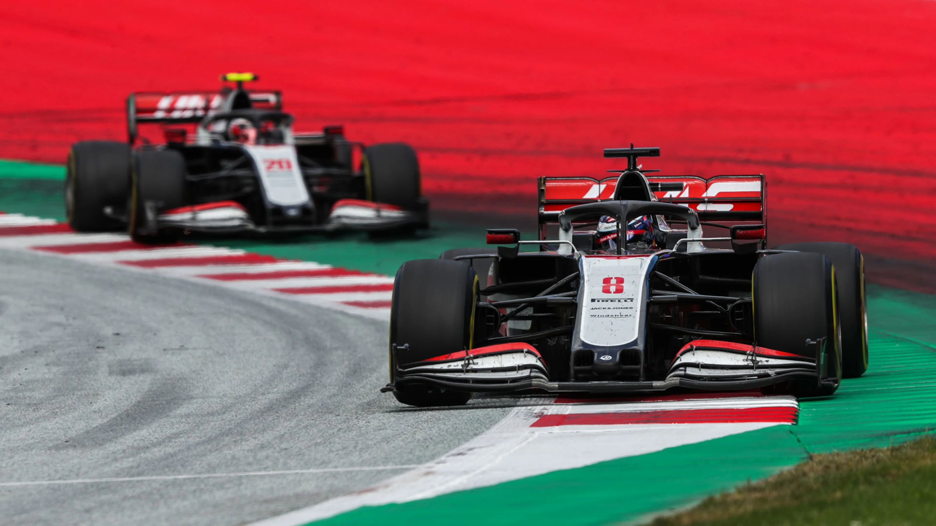 Romain Grosjean, Haas VF-20, leads Kevin Magnussen, Haas