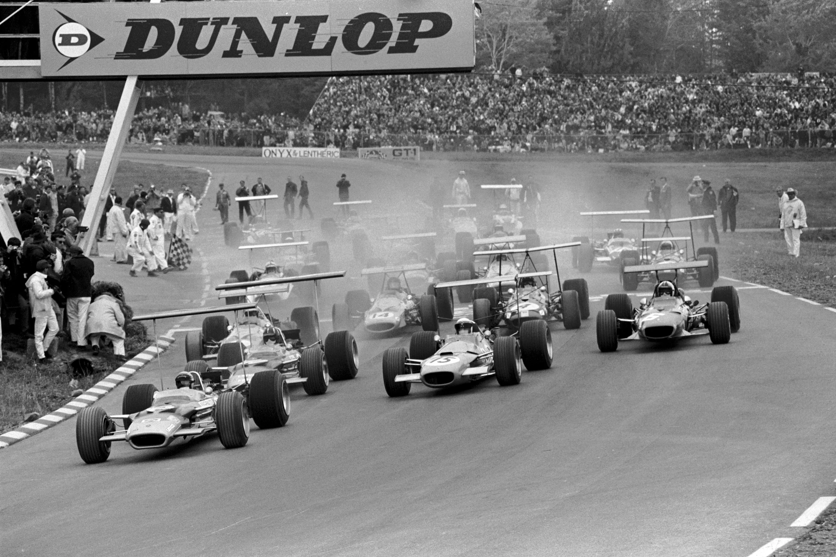 Pole position man Mario Andretti(USA) Lotus 49B gets away ahead of Graham Hill(GBR) Lotus 49B and