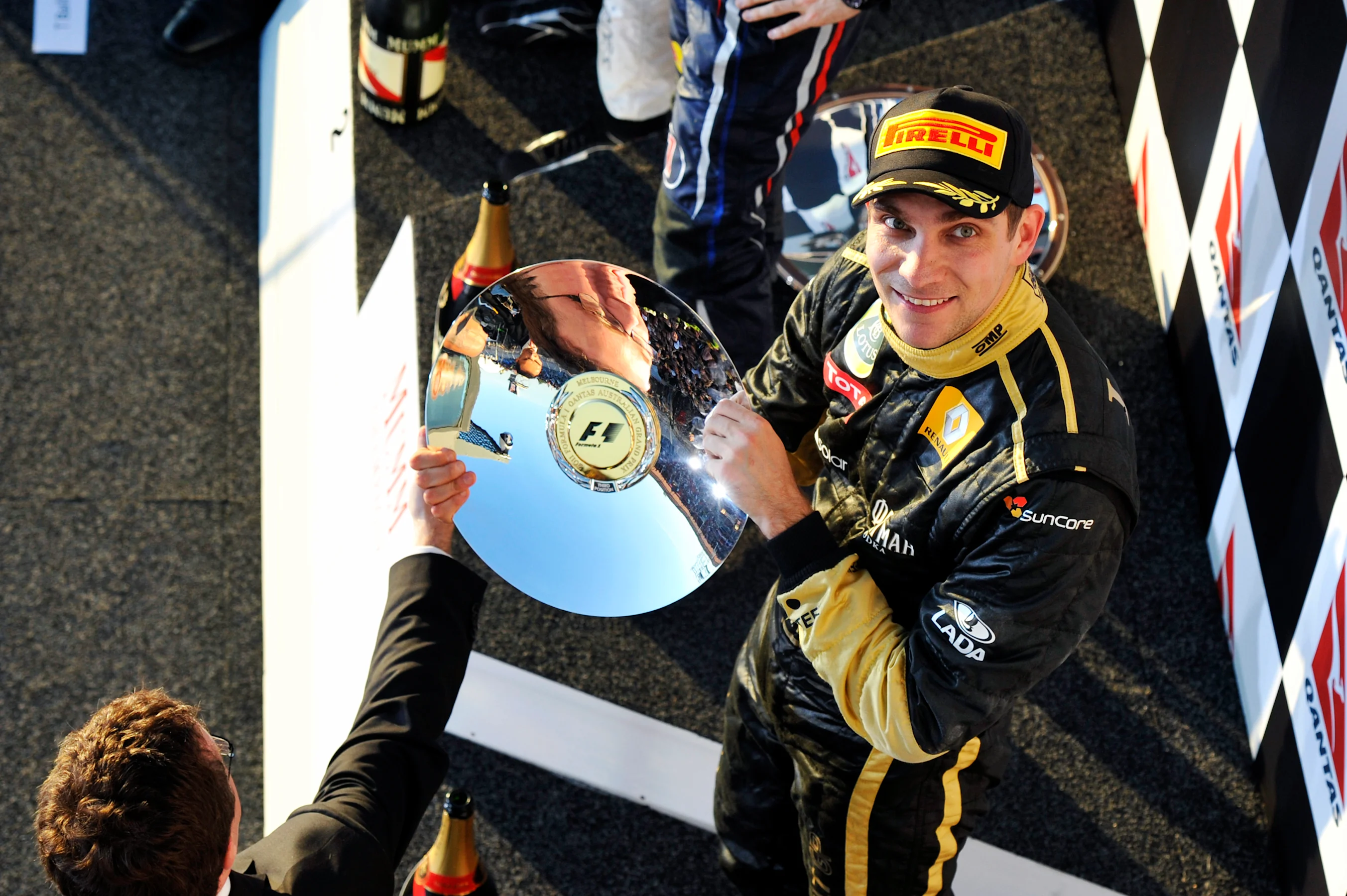 Vitaly Petrov (RUS) Lotus Renault GP celebrates his third position on the podium.  Formula One