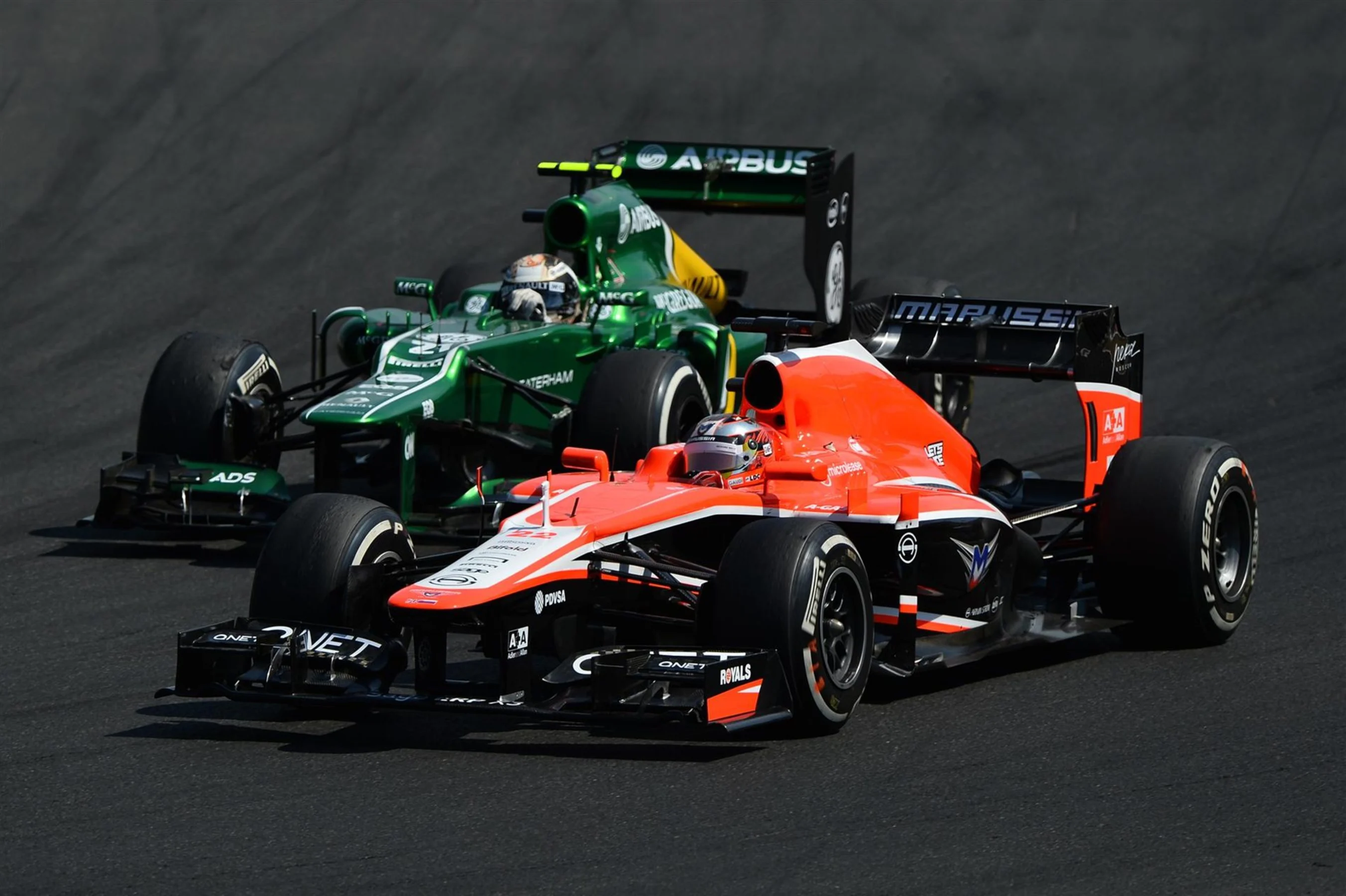 Giedo van der Garde (NDL) Caterham CT03 overtakes Jules Bianchi (FRA) Marussia F1 Team MR02.