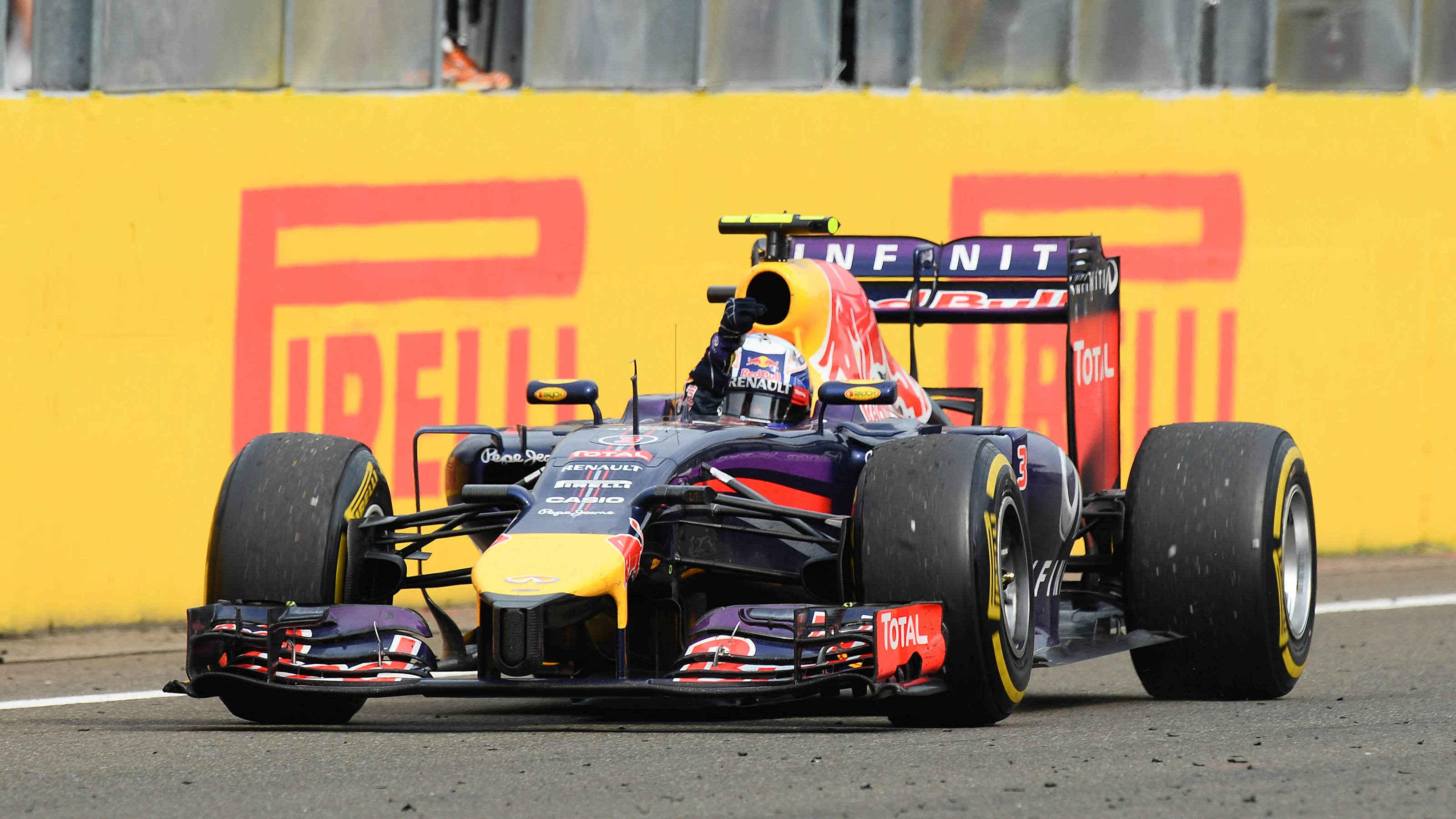 Race winner Daniel Ricciardo (AUS) Red Bull Racing RB10 crosses the line. Formula One World