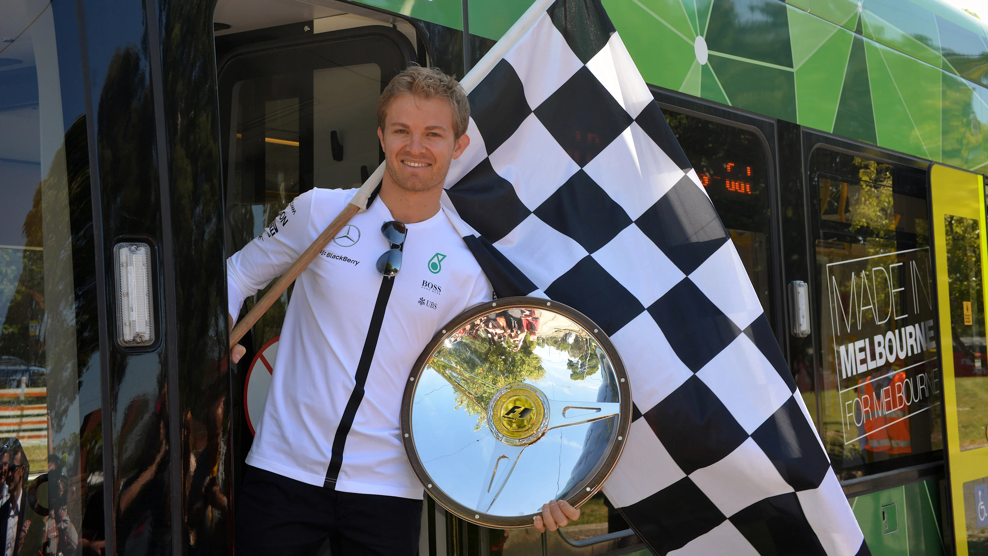 Nico Rosberg (GER) Mercedes AMG F1 with his 2014 Australian GP winners trophy aboard the Rosberg